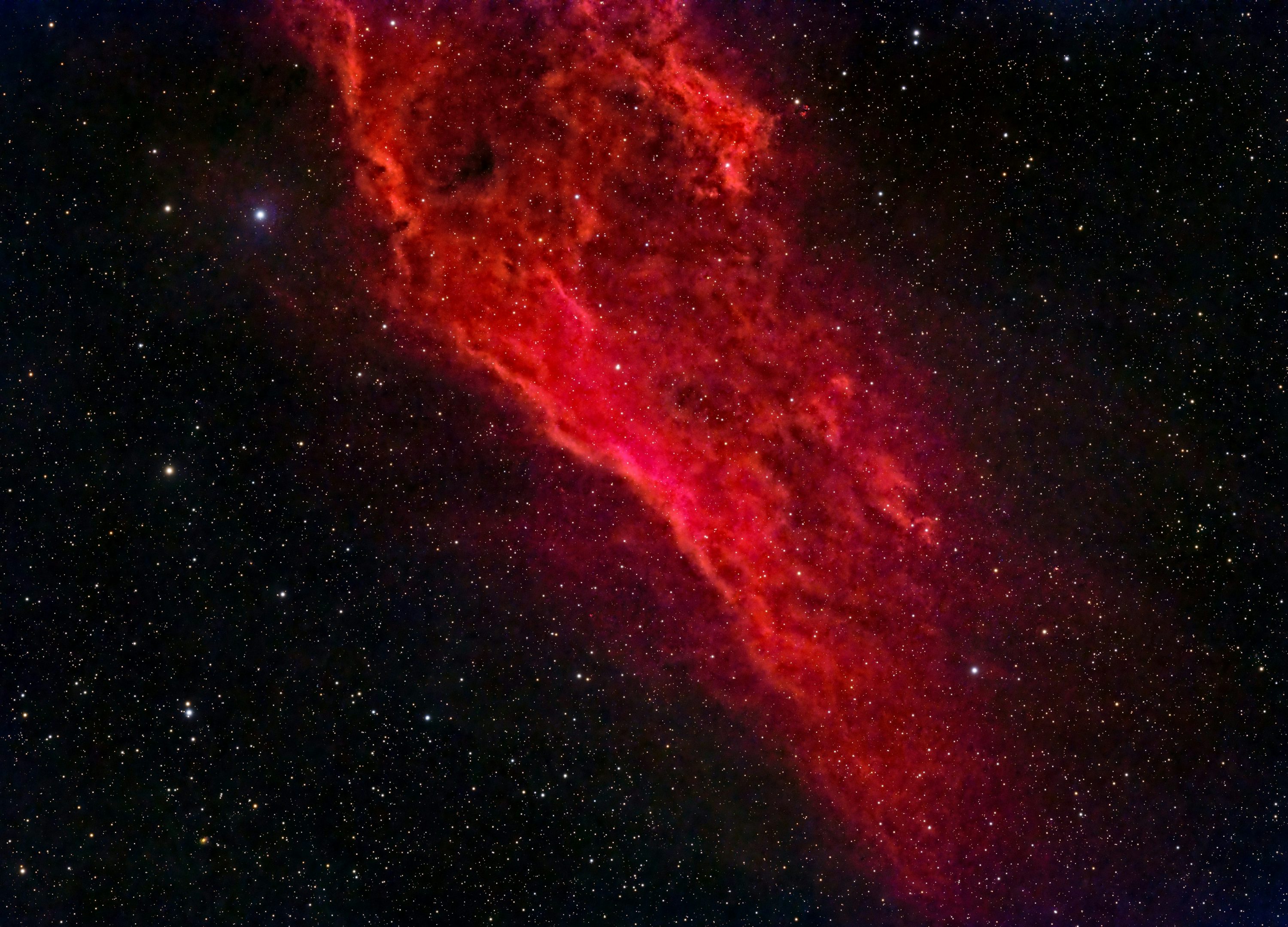 A large red object in the middle of the night sky photo