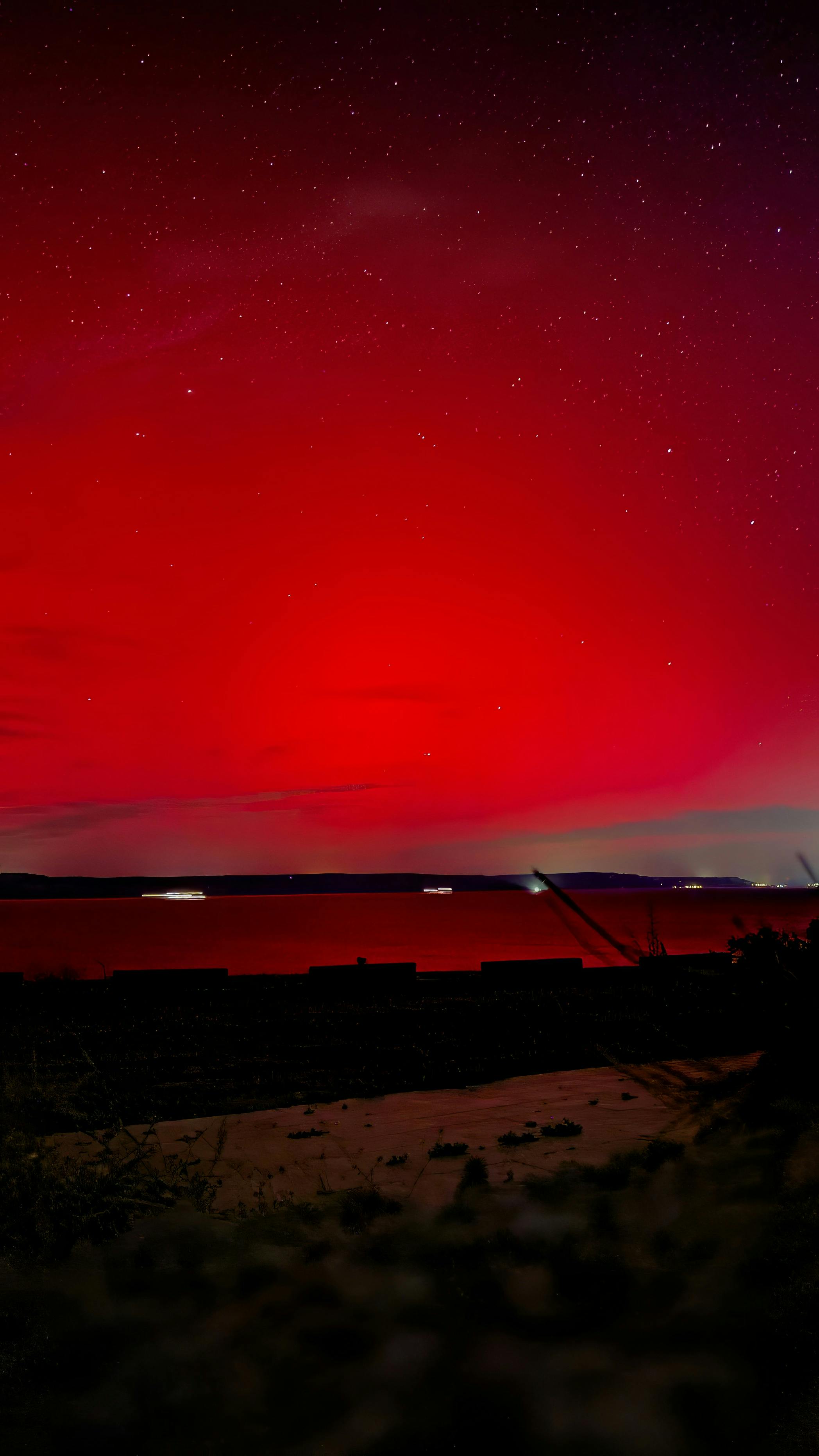 Stunning Red Night Sky Over Waterfront · Free