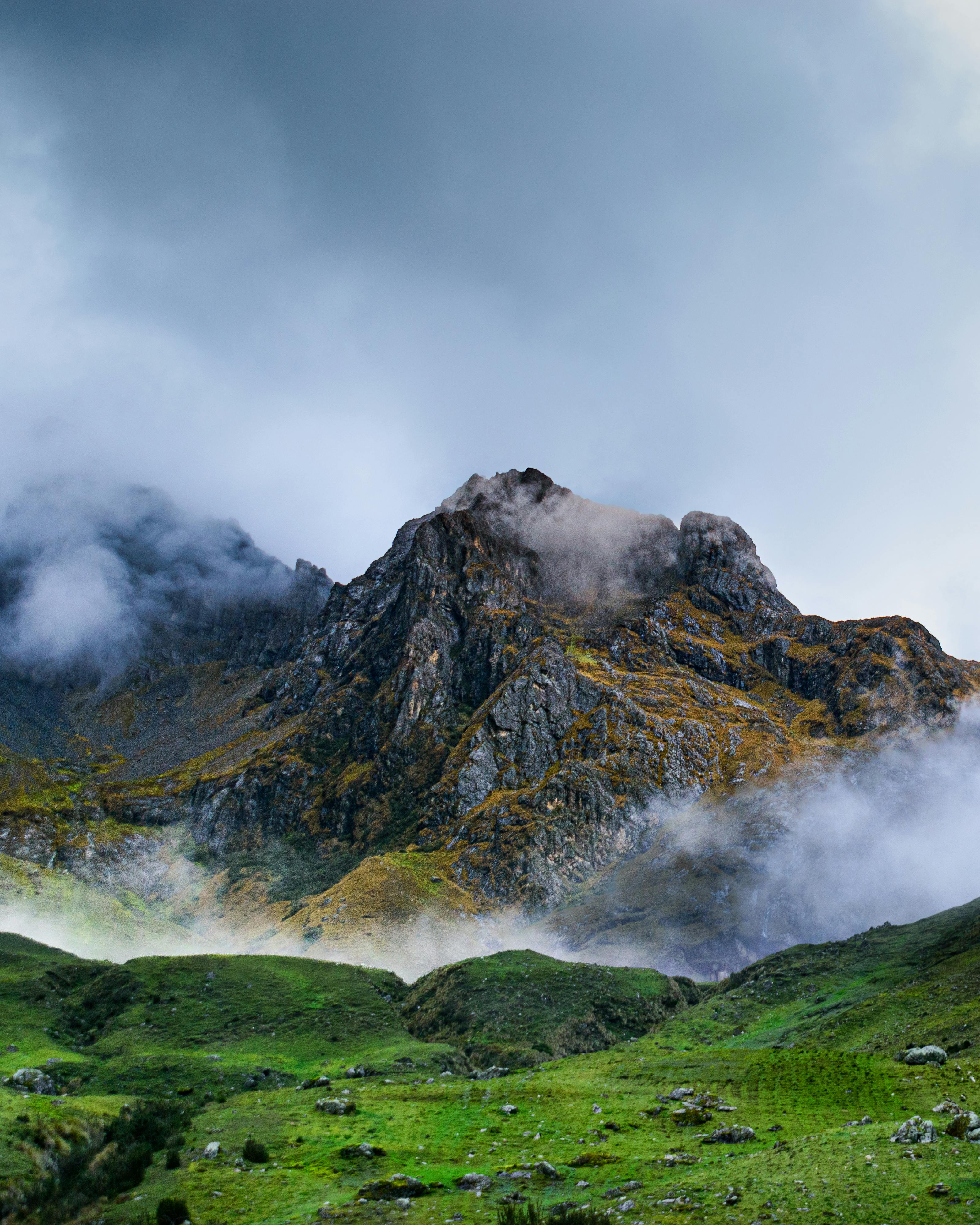 Photography of Mountains Under Cloudy Sky · Free