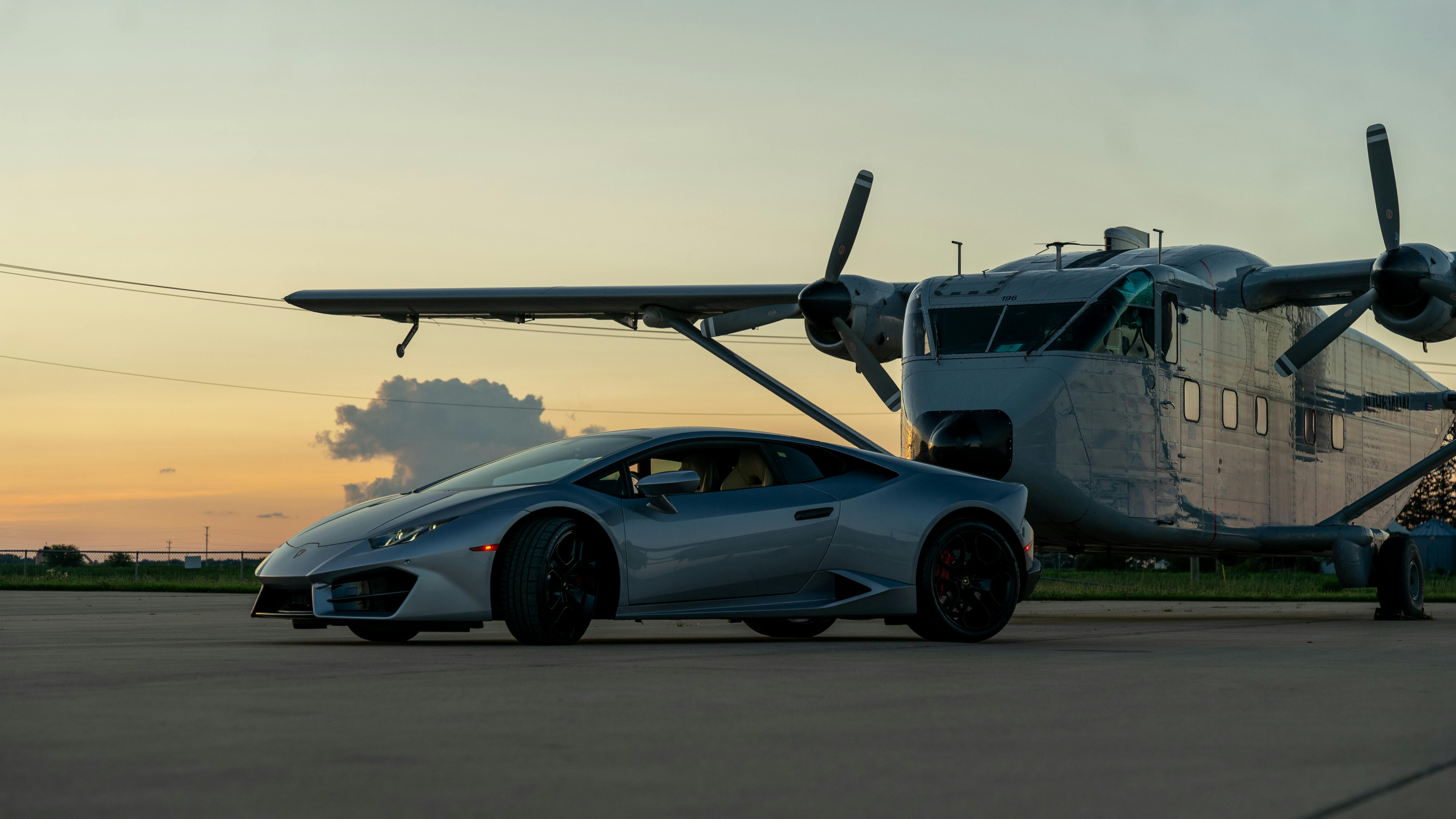 Luxury Sports Car and Private Jet on Runway · Free