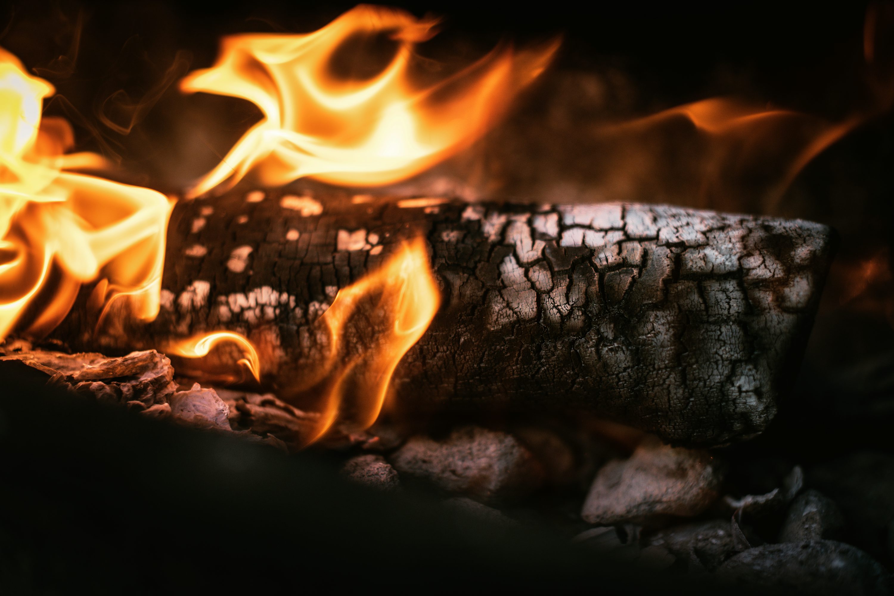 A close up of a fire burning in a fireplace photo