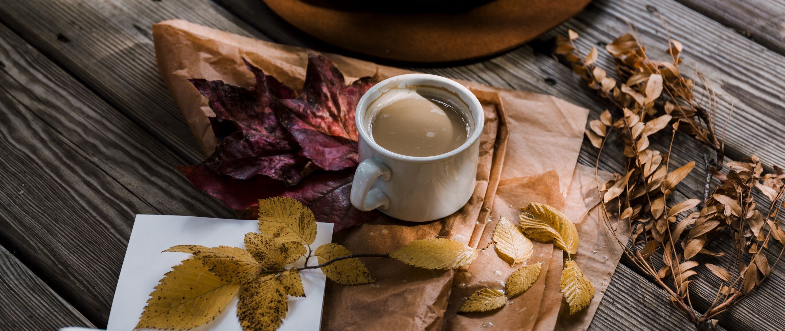 Download wallpaper 2560x1080 coffee, autumn, hat, foliage dual wide 1080p HD background