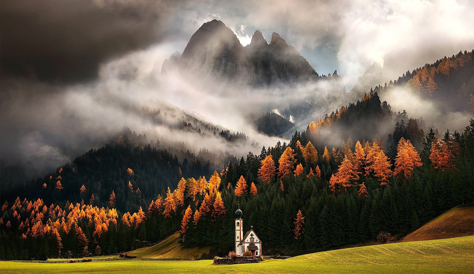 Misty Mountain Church Amidst Autumn Forest Peaks