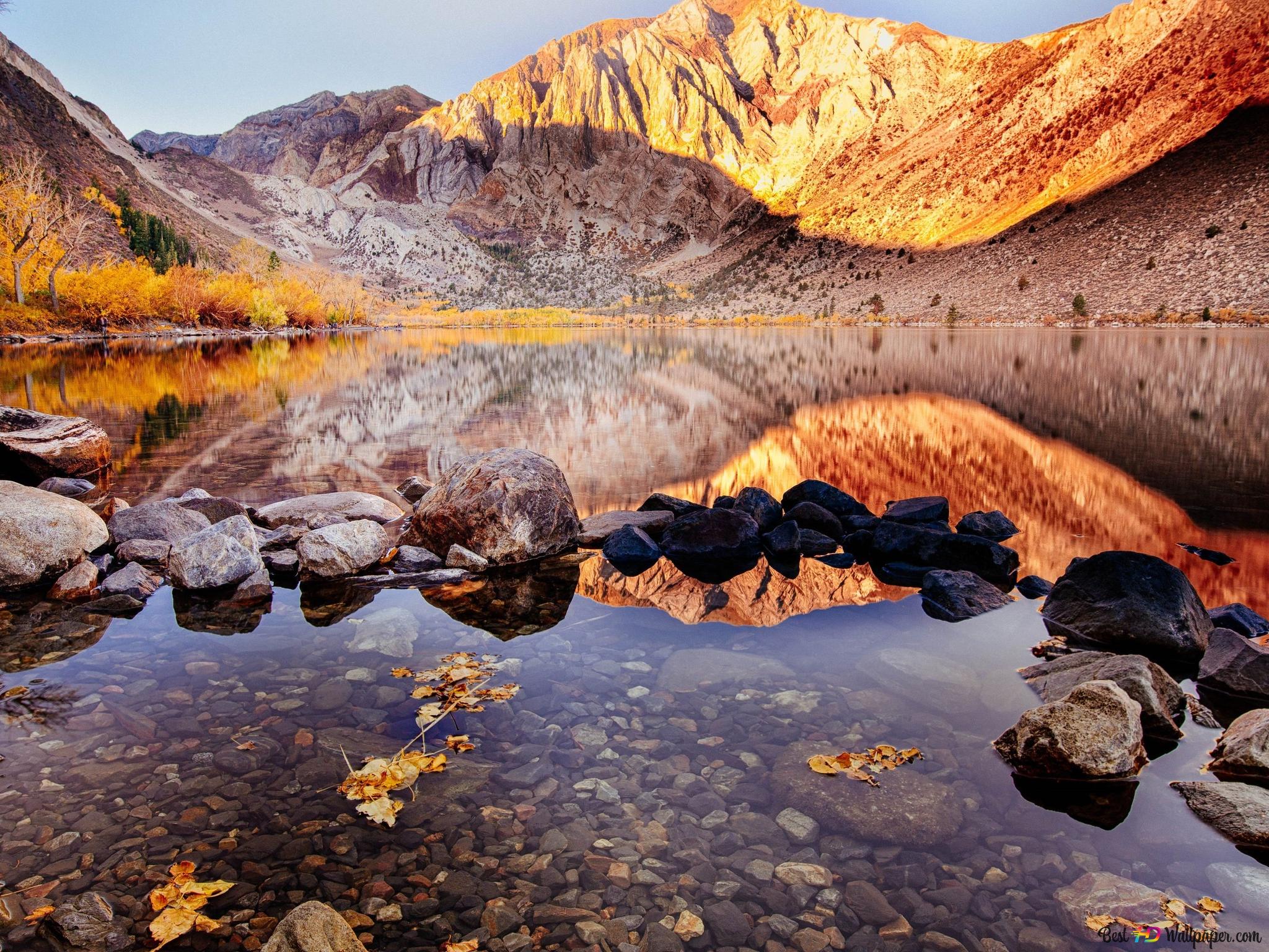 Reflection of stones and rocks in water in autumn landscape 4K wallpaper download