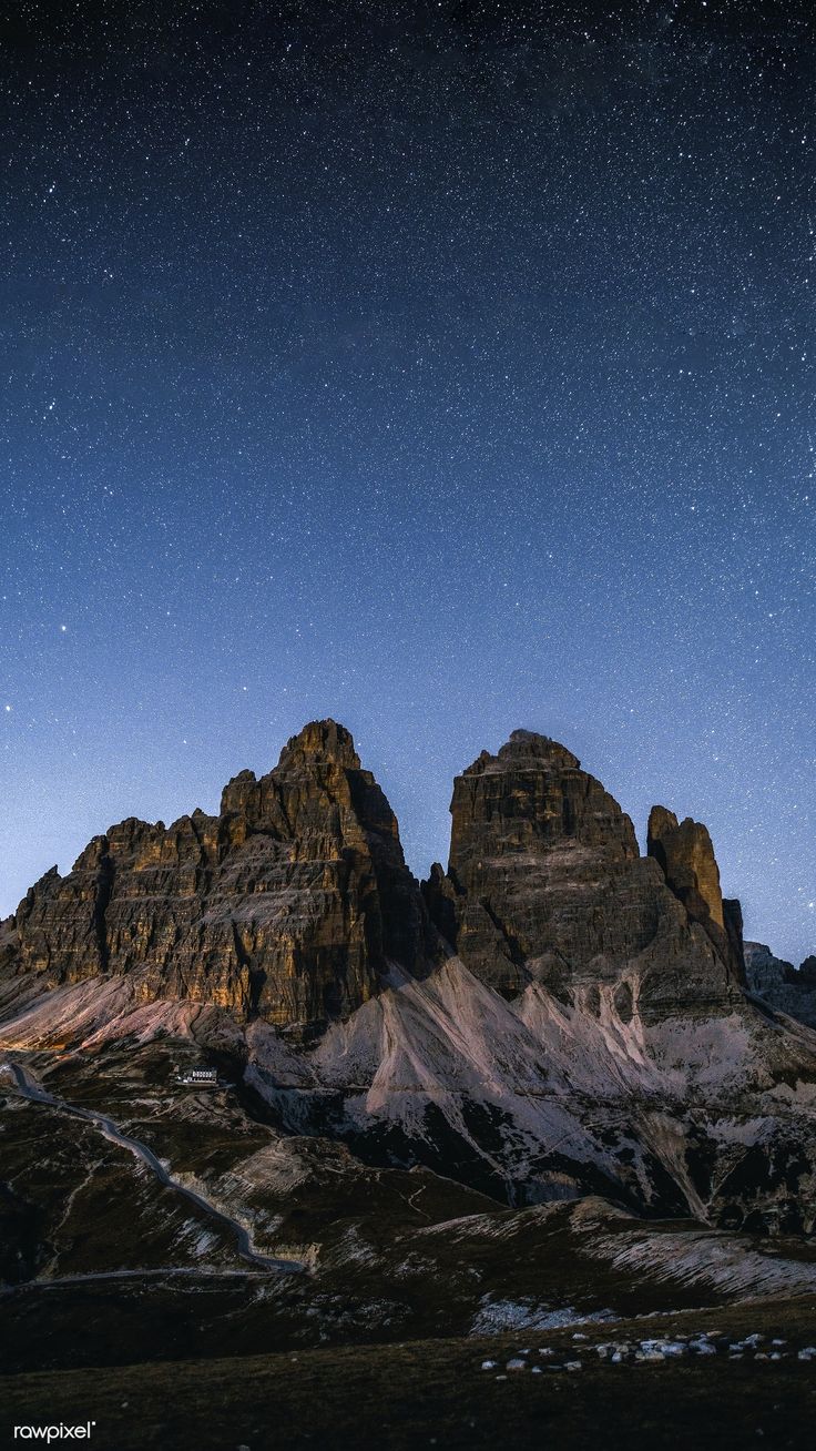 Download premium image of Tre Cime di Lavaredo at night in the Dolomites mobile phone wallpaper by Luke Stackpoole about iphone wallpaper dark, iphone wallpaper, iphone wallpaper italy, night view mountain peak