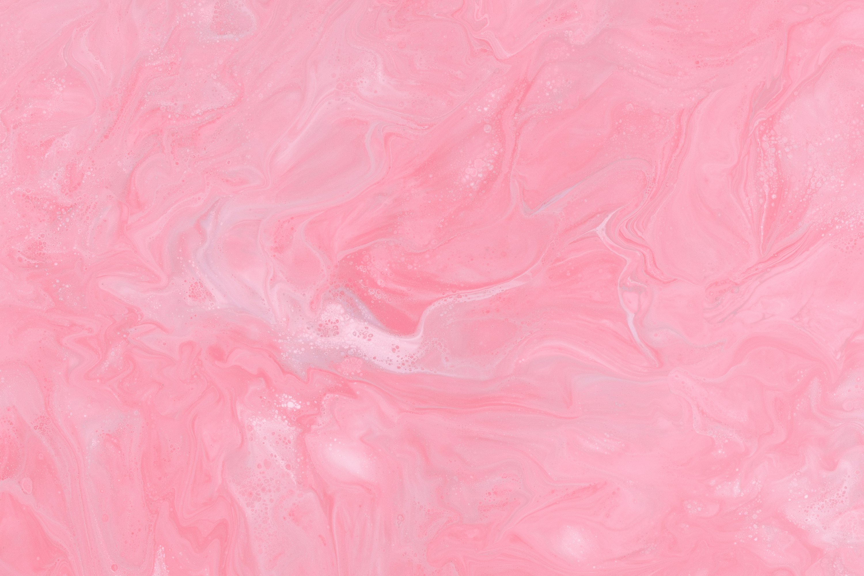A close up of a pink marble texture photo