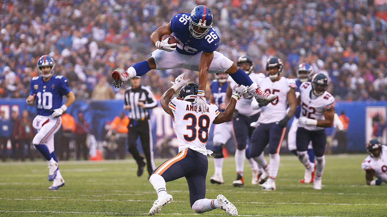 Saquon Barkley shows vertical as he hurdles a defender