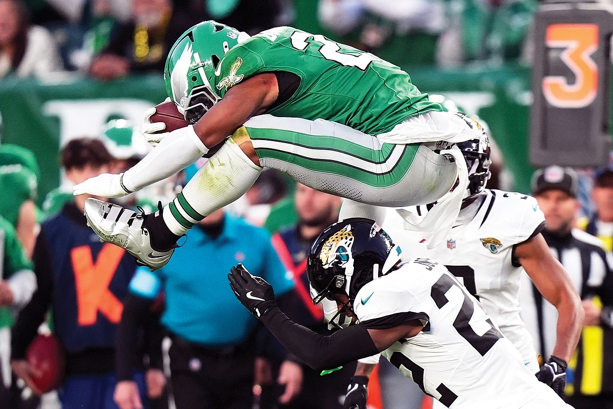 Barkley Amazes With Backward Hurdle For First Down Reception. Jefferson City News Tribune