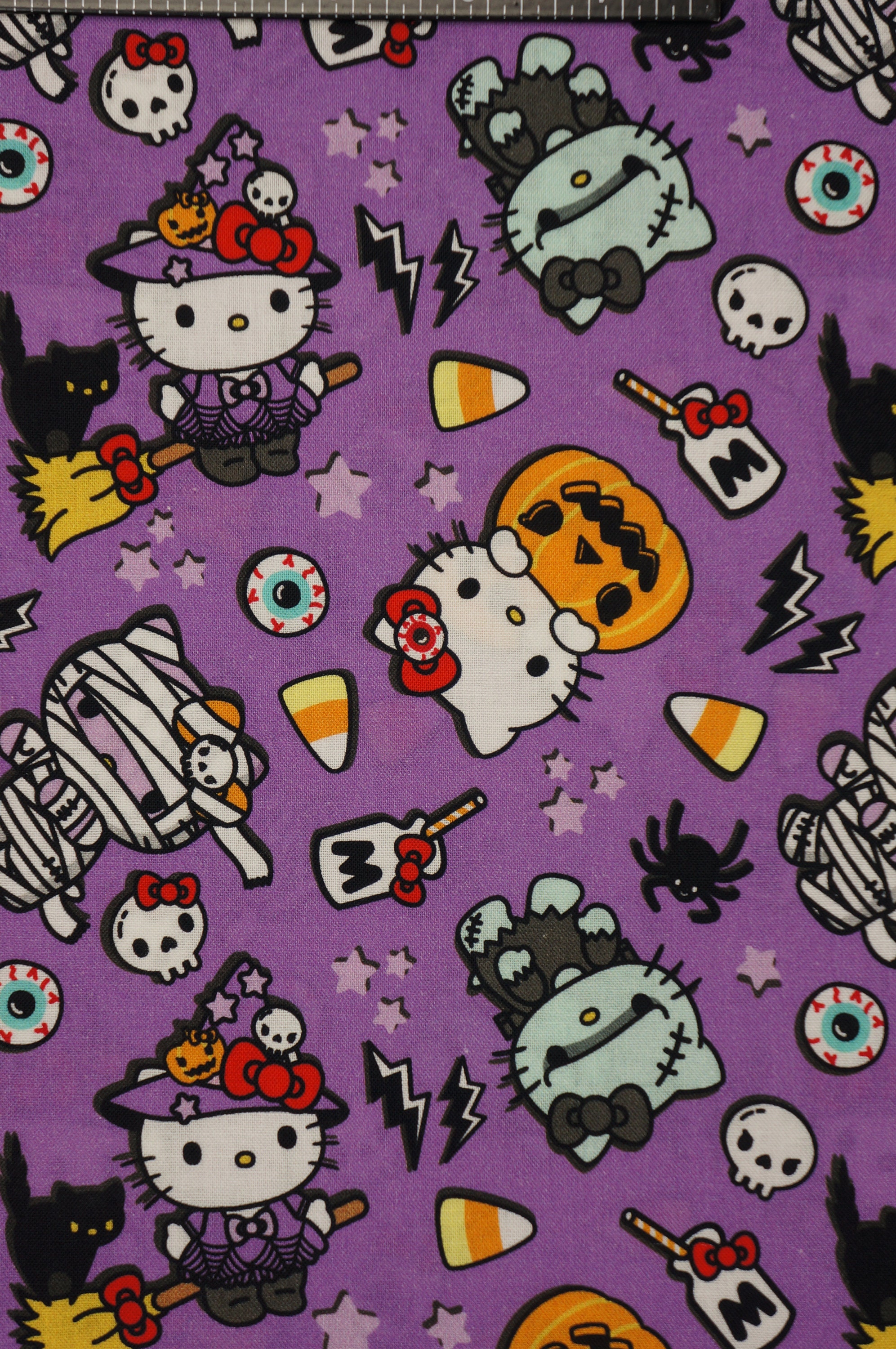 Hello Kitty Halloween Fabric, Hello Kitty Costume on Purple Licensed by Sanrio for Springs Creative Novelty Cotton Fabric