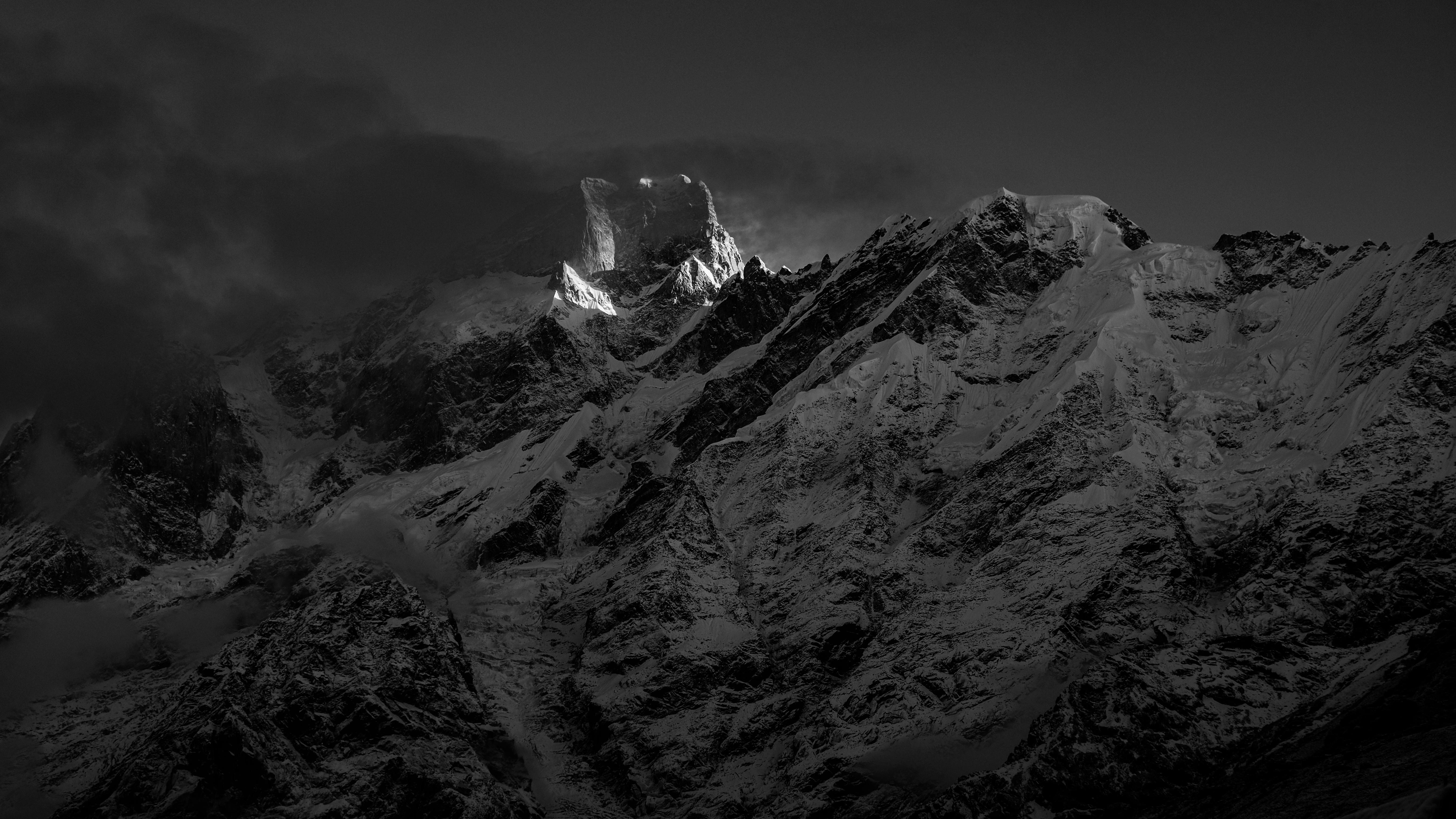 Black and White Photo of a Mountain Range at Dusk · Free