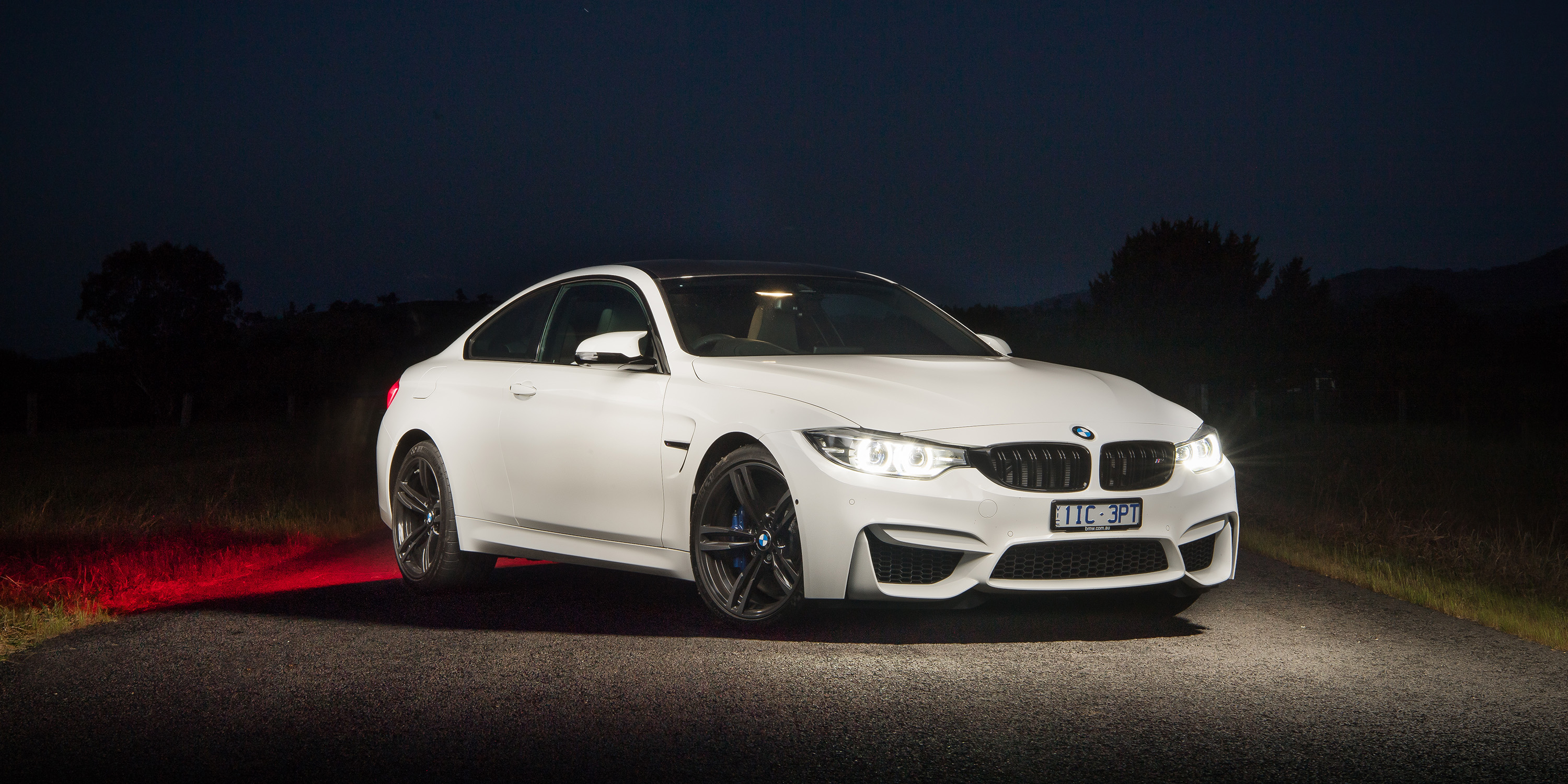 White BMW M4 Coupe Pure Edition with headlights on Desktop wallpaper 1440x900