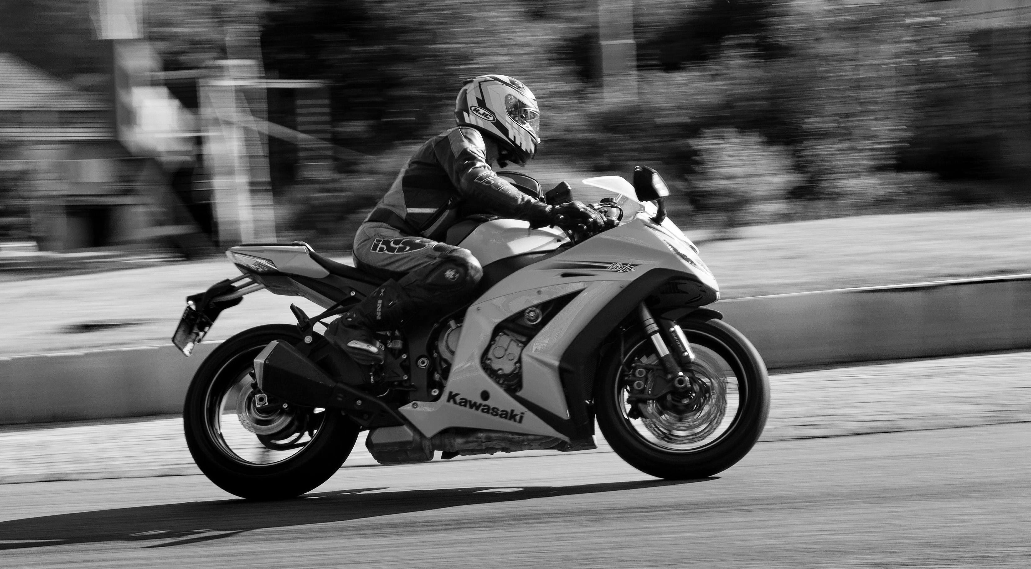 Black and White Photo of Person Riding a Motorcycle · Free