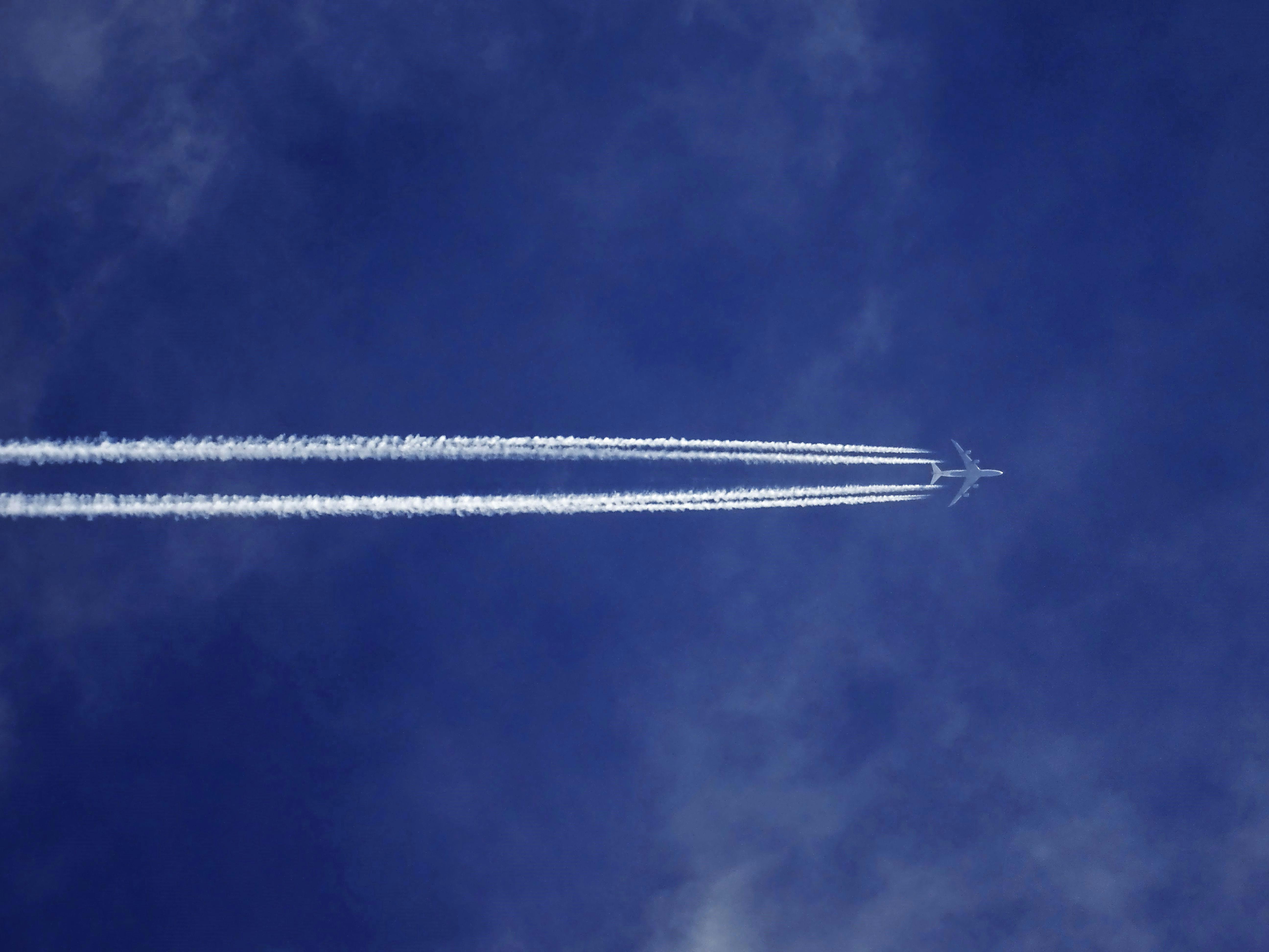 Bottom View of Plane With Contrail · Free
