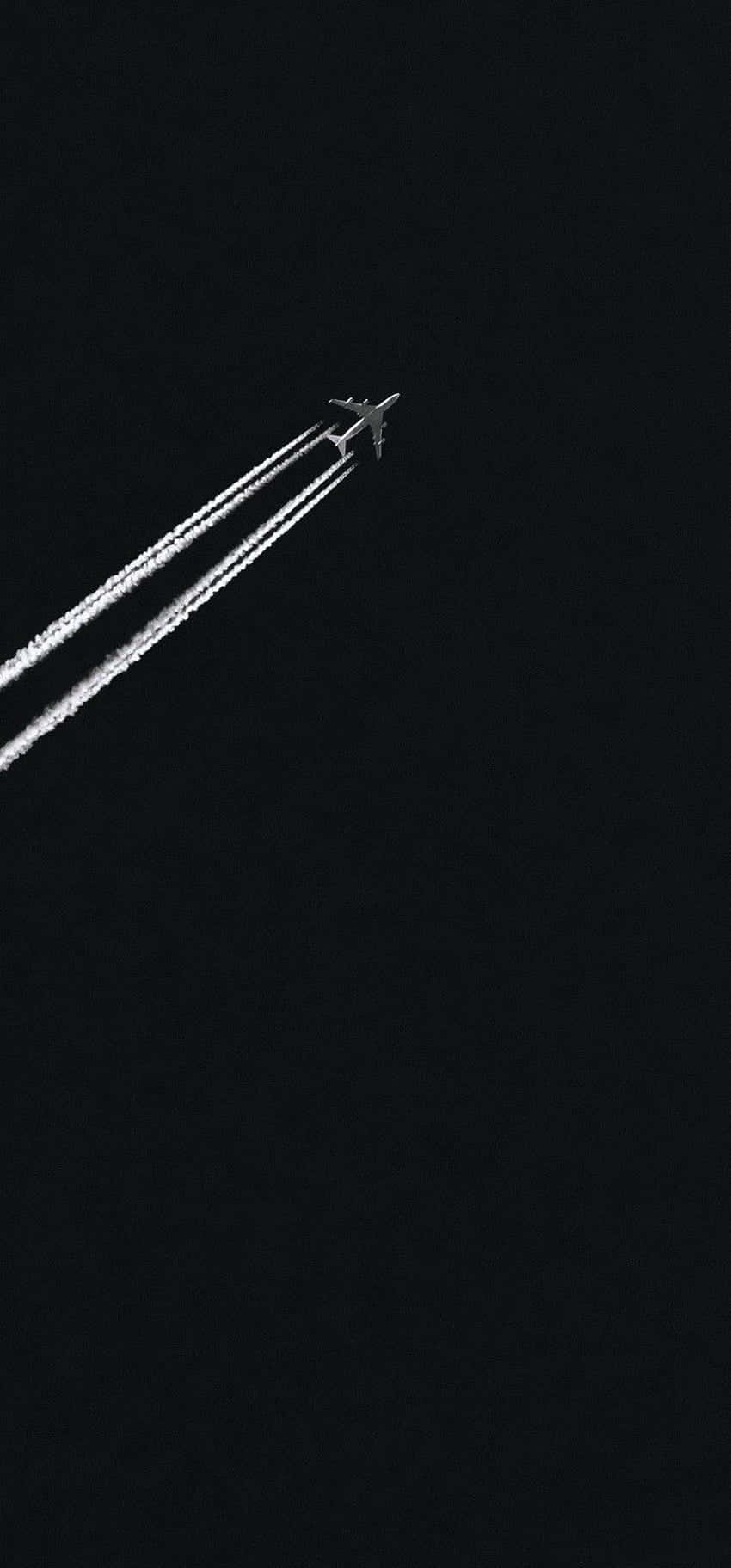 Download Jet_ Contrail_ Against_ Dark_ Sky Wallpaper