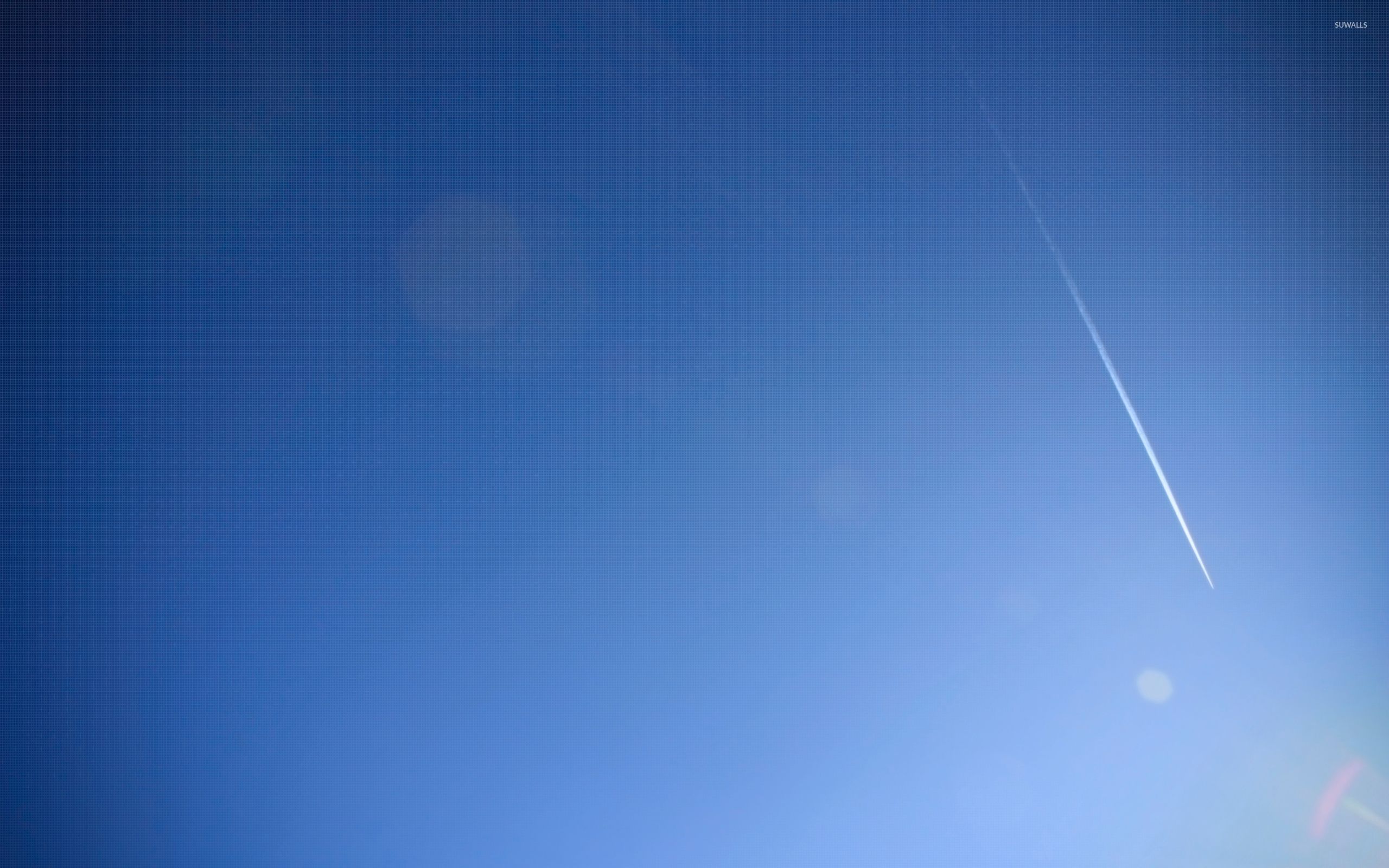 Contrail on doted sky wallpaper wallpaper