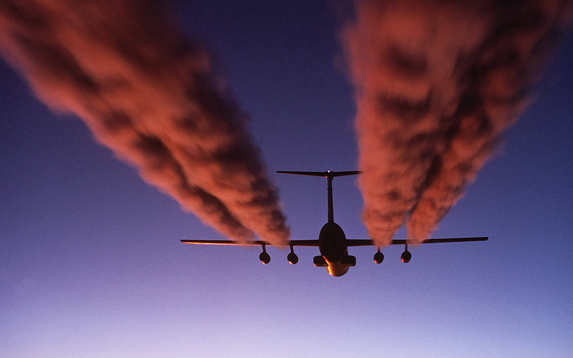 Download HD Plane With Red Contrails Wallpaper