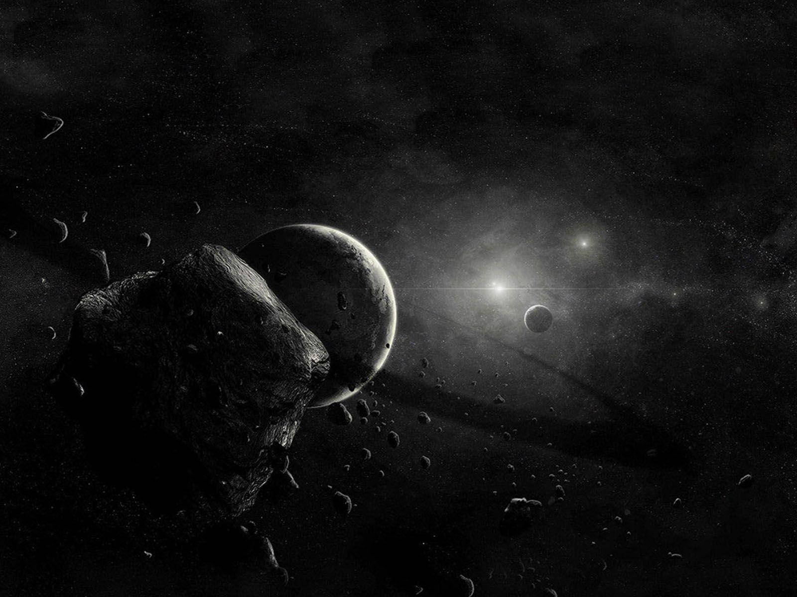 Download Black Planet Behind Asteroid Wallpaper