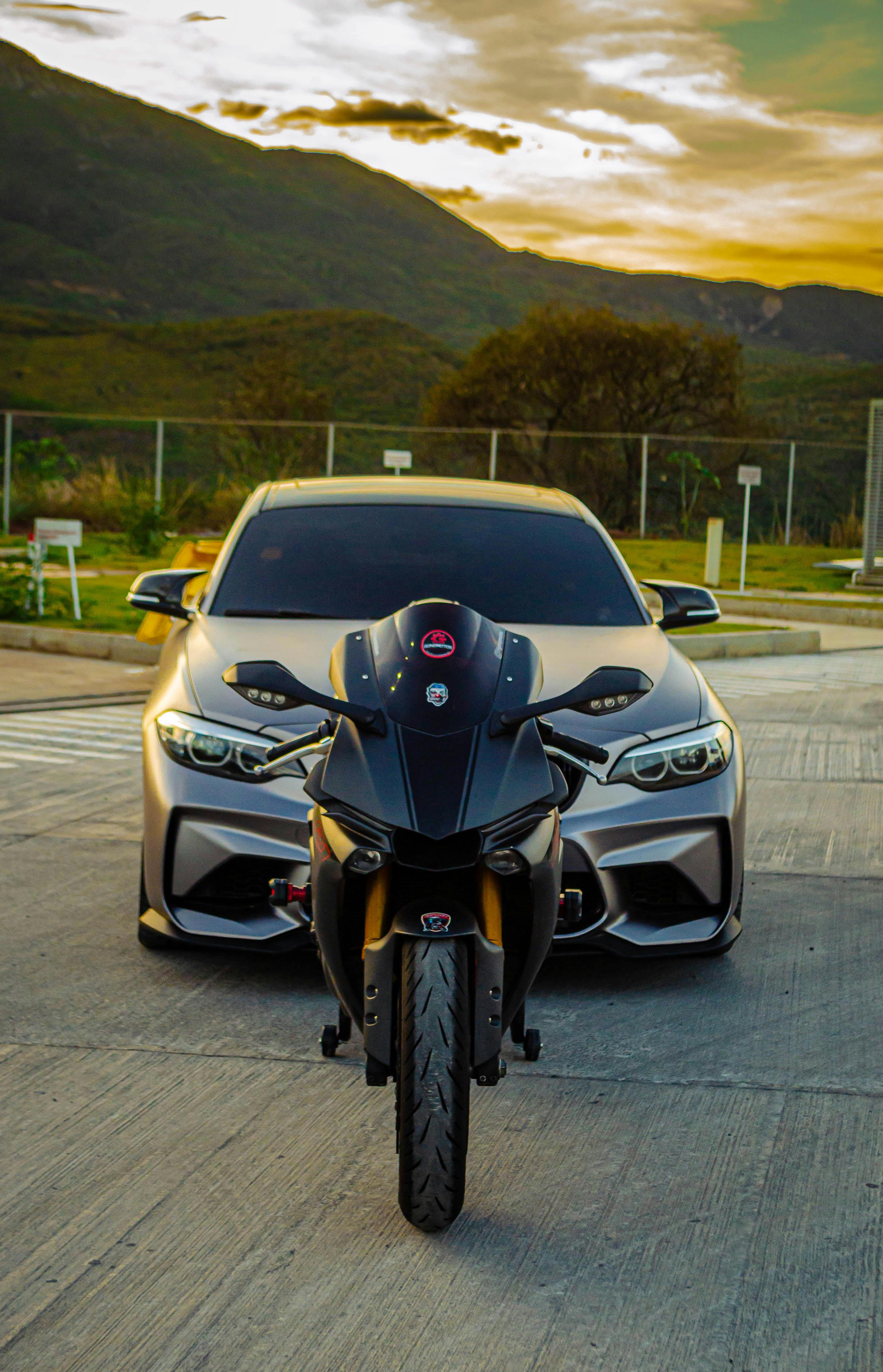 Yamaha Motorbike and BMW Sports Car behind · Free