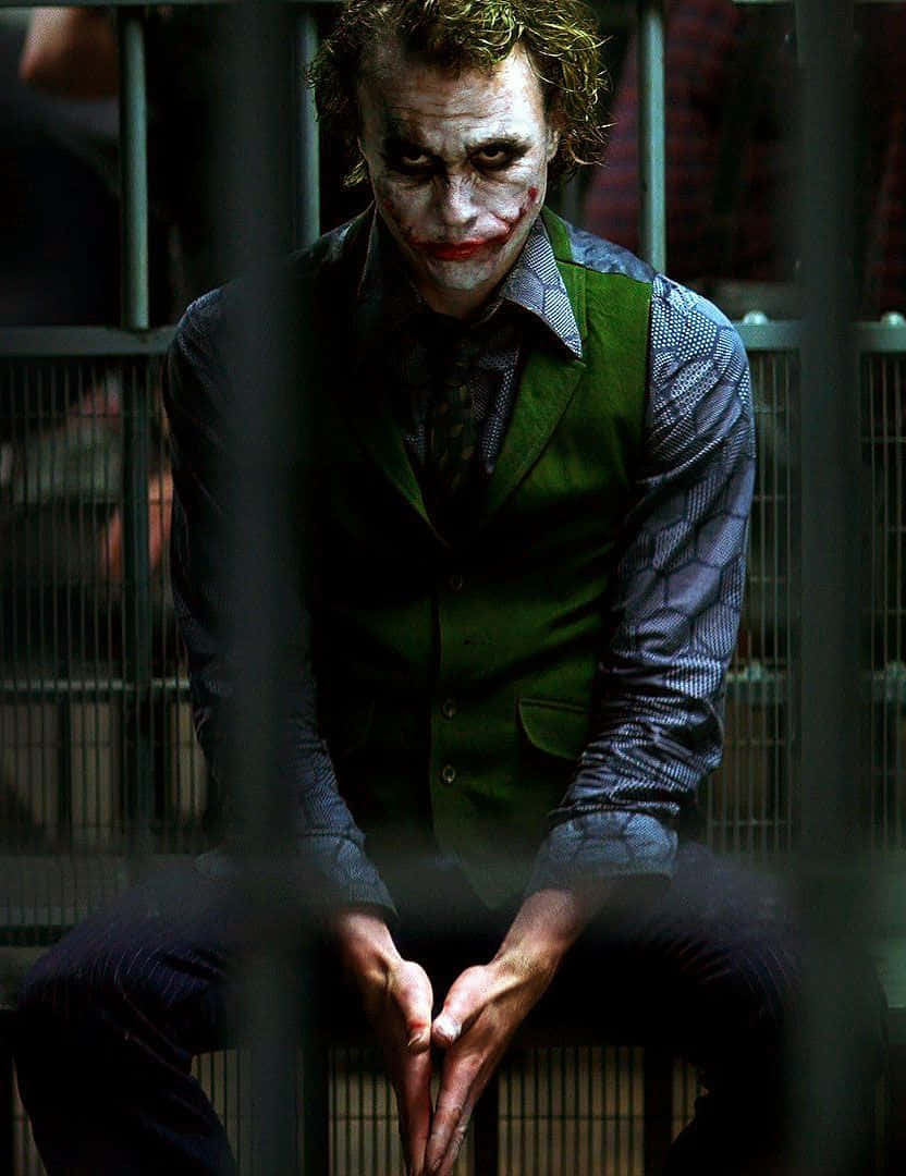 Download Joker Pfp Sitting In Jail Wallpaper