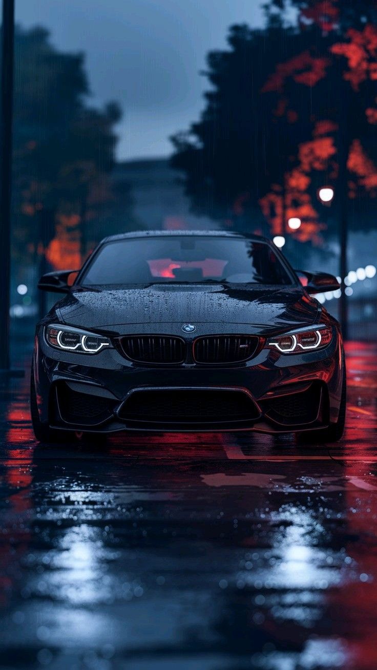 All Black BMW In Rain With Reflections Of City Light