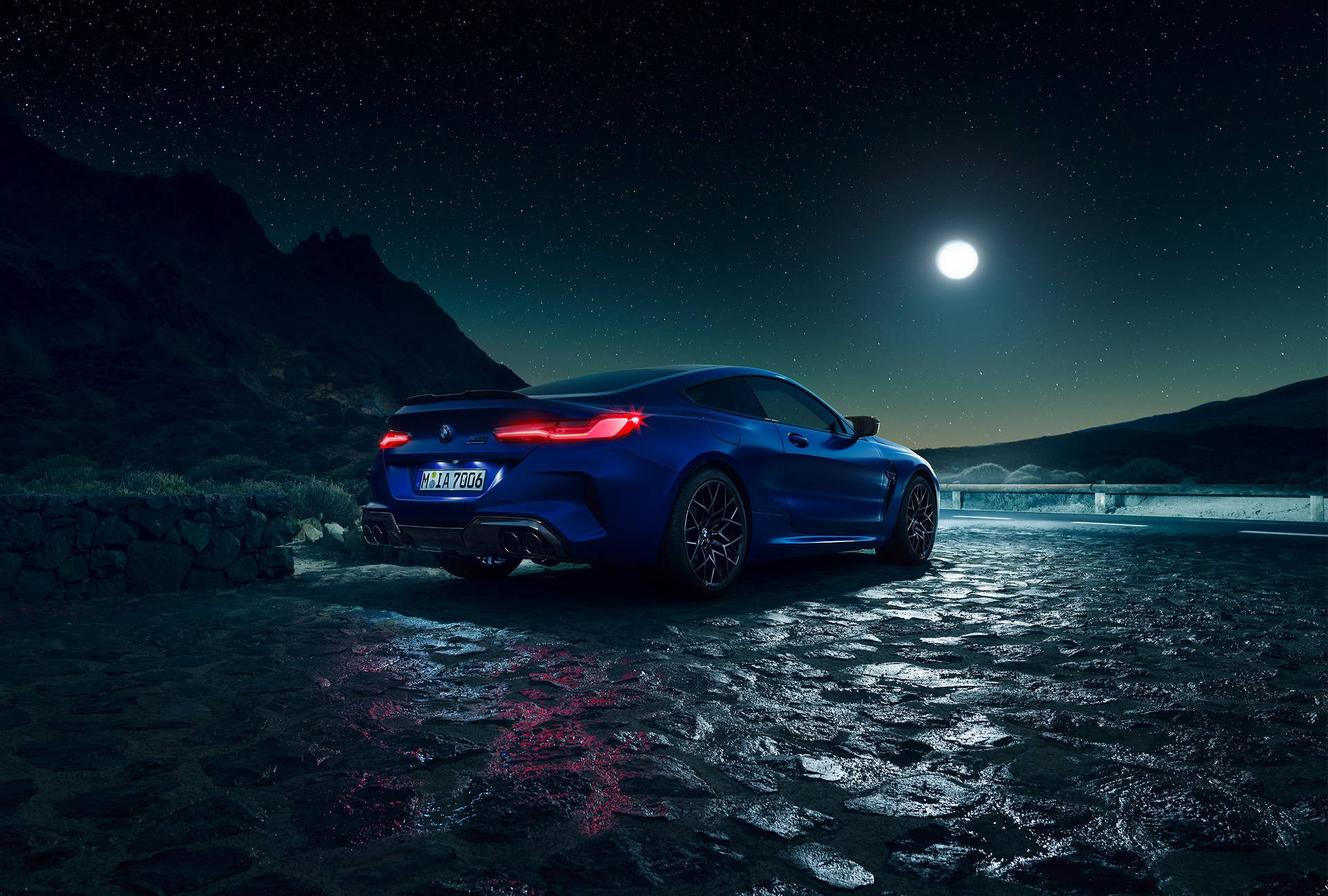 Download Blue BMW And A Starry Night Sky Wallpaper