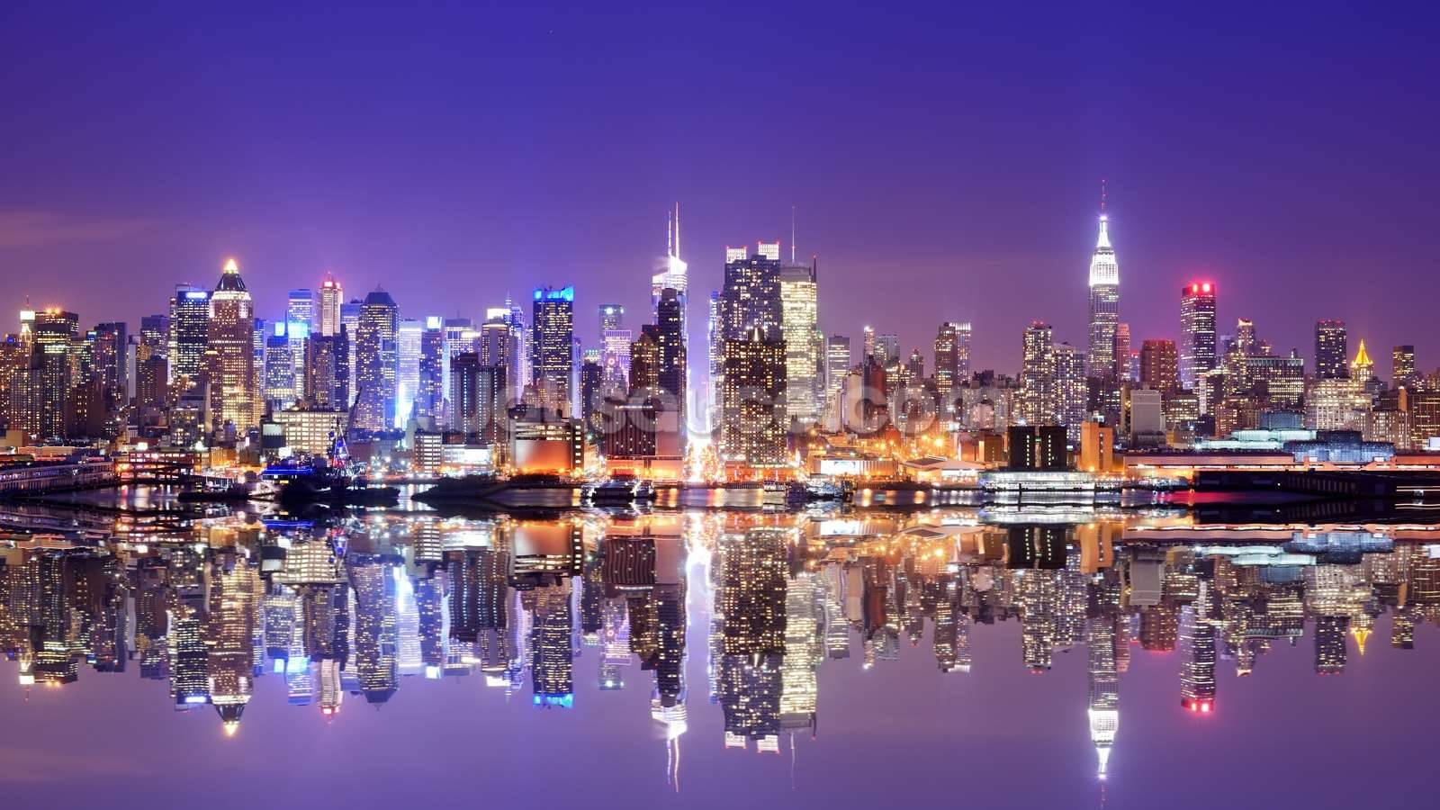 Download Sunrise over the Manhattan skyline in New York City Wallpaper