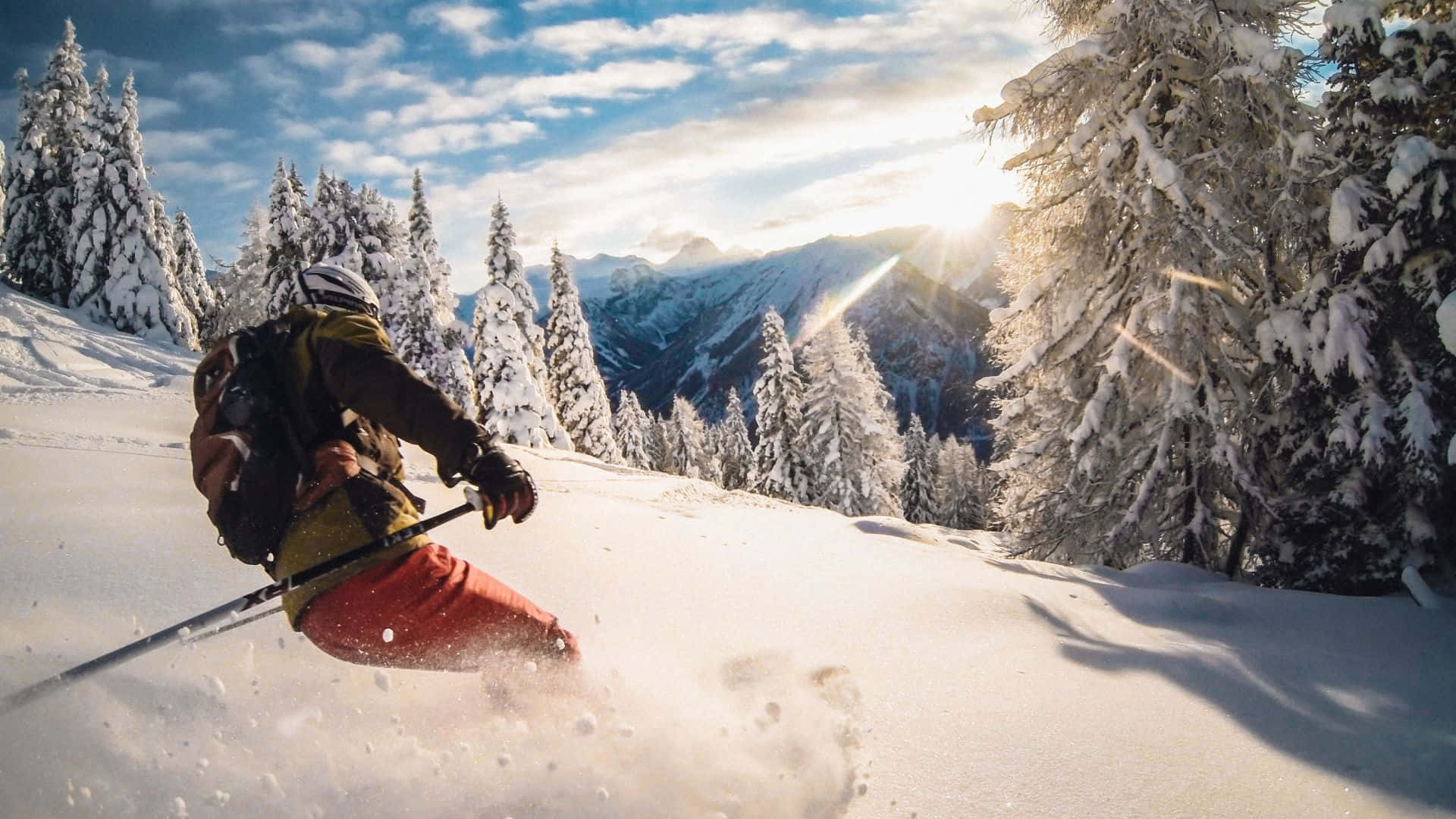 Download Enjoy The Thrill Of Skiing On A Snow Capped Mountain