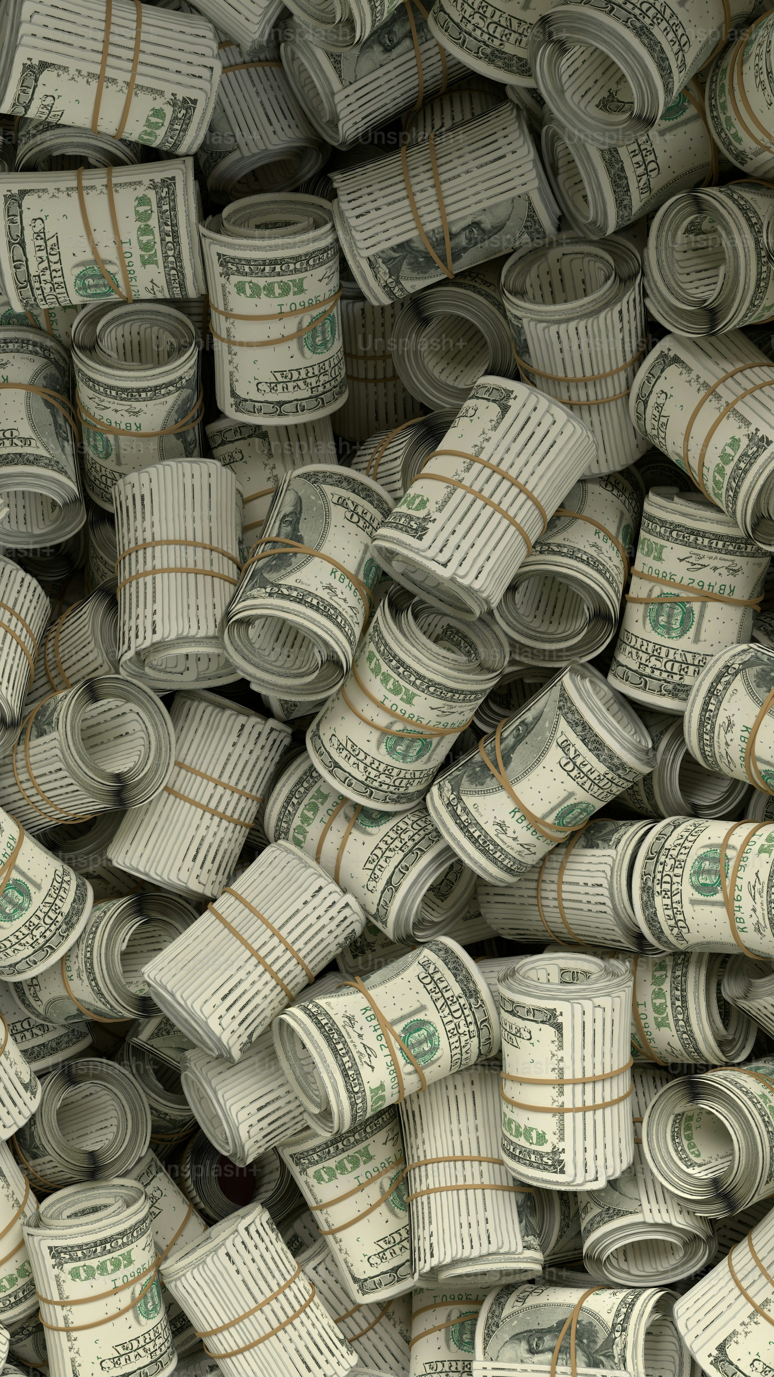 A pile of rolled up money sitting on top of each other photo
