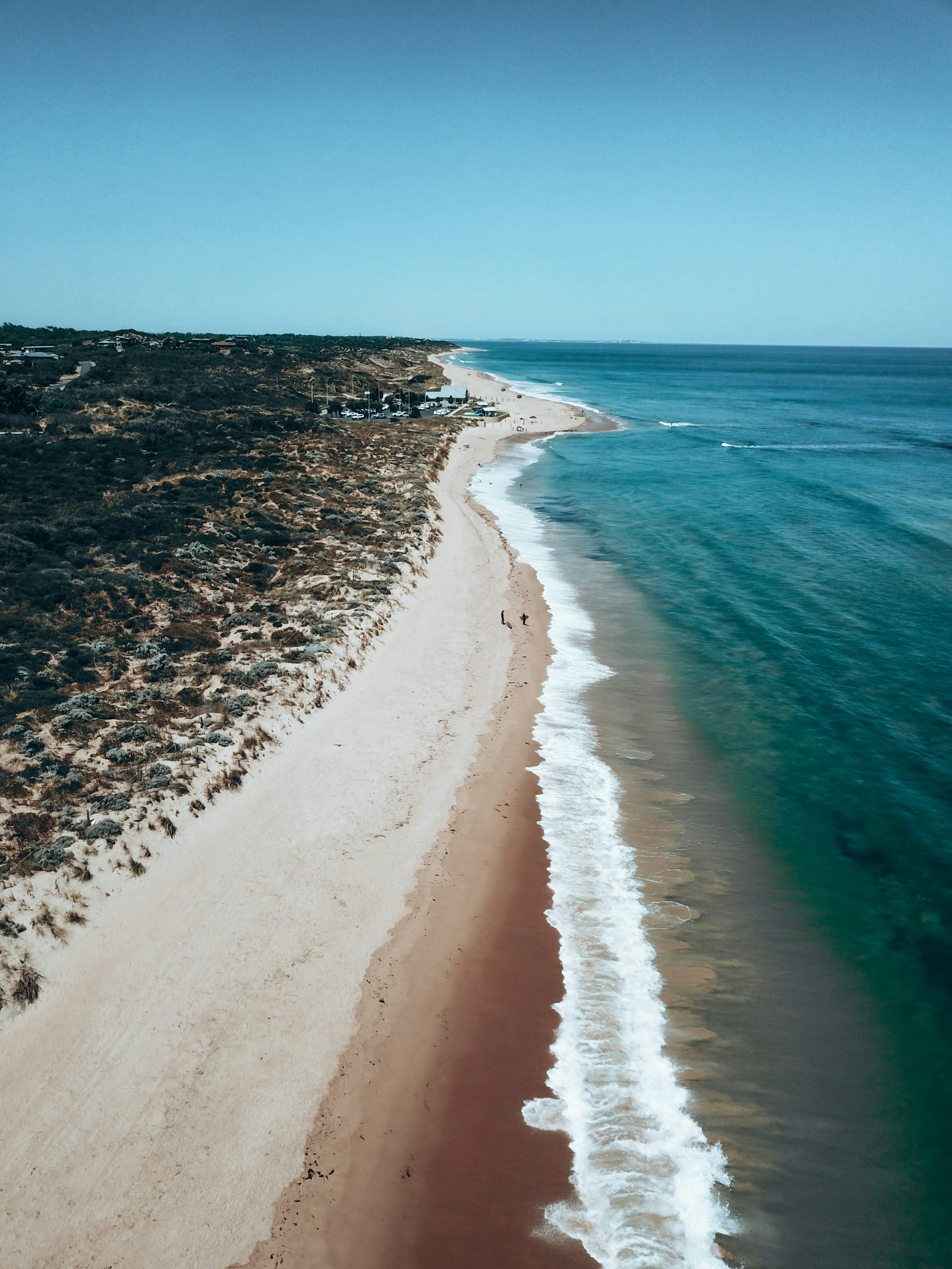 White sand beach during daytime photo