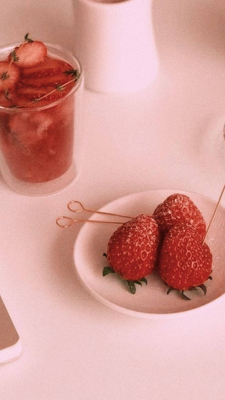 Download A Plate With Strawberries And A Cup Of Coffee Wallpaper