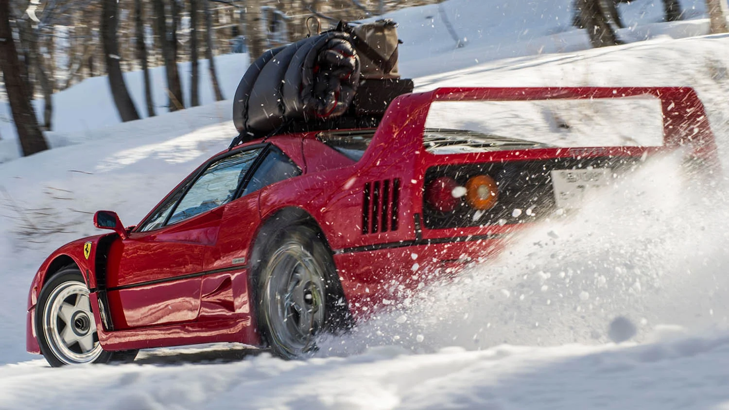 Drifting a Ferrari F40 in the snow. up a mountain