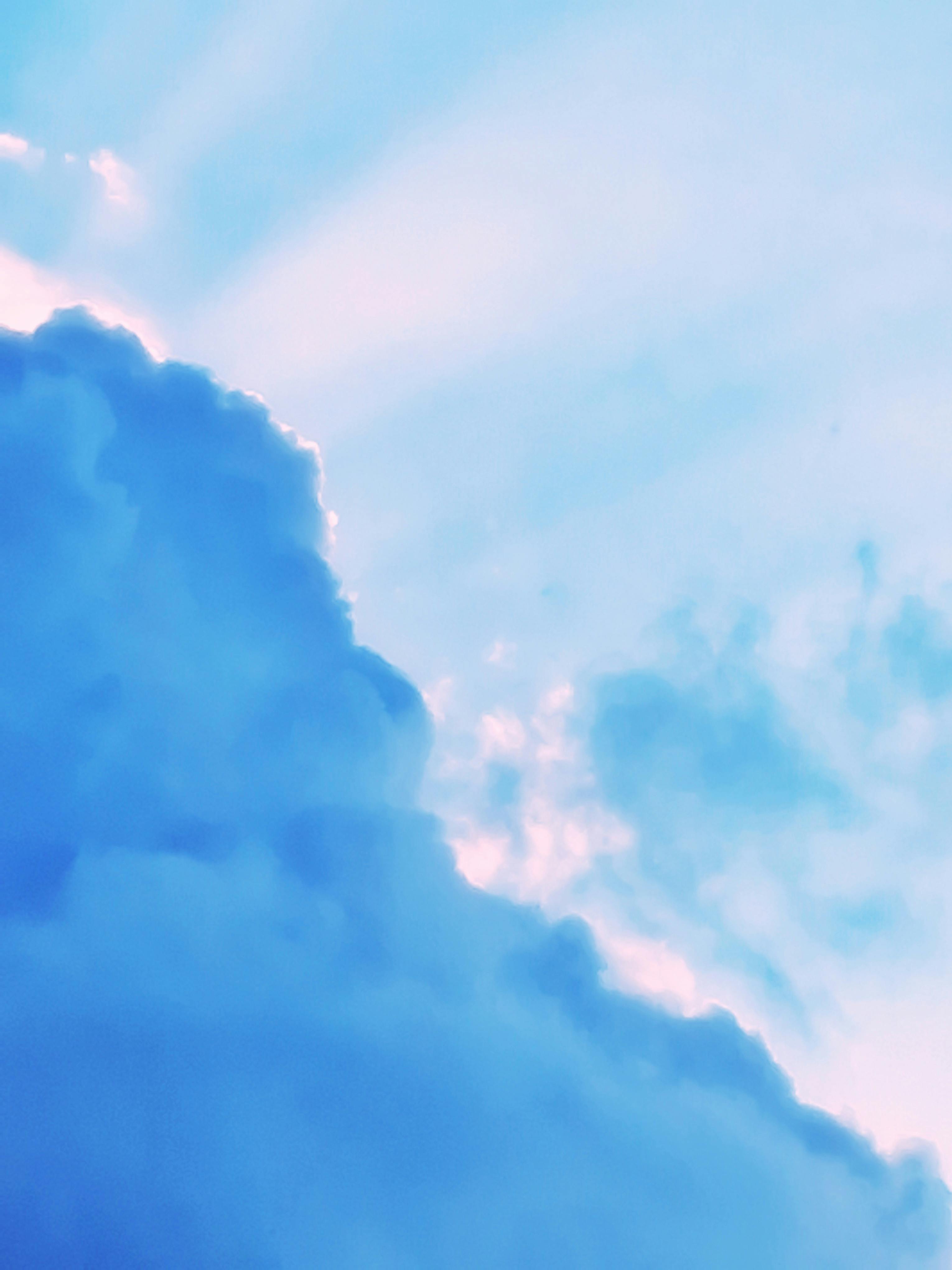 Soft Blue Clouds Against Bright Sky · Free