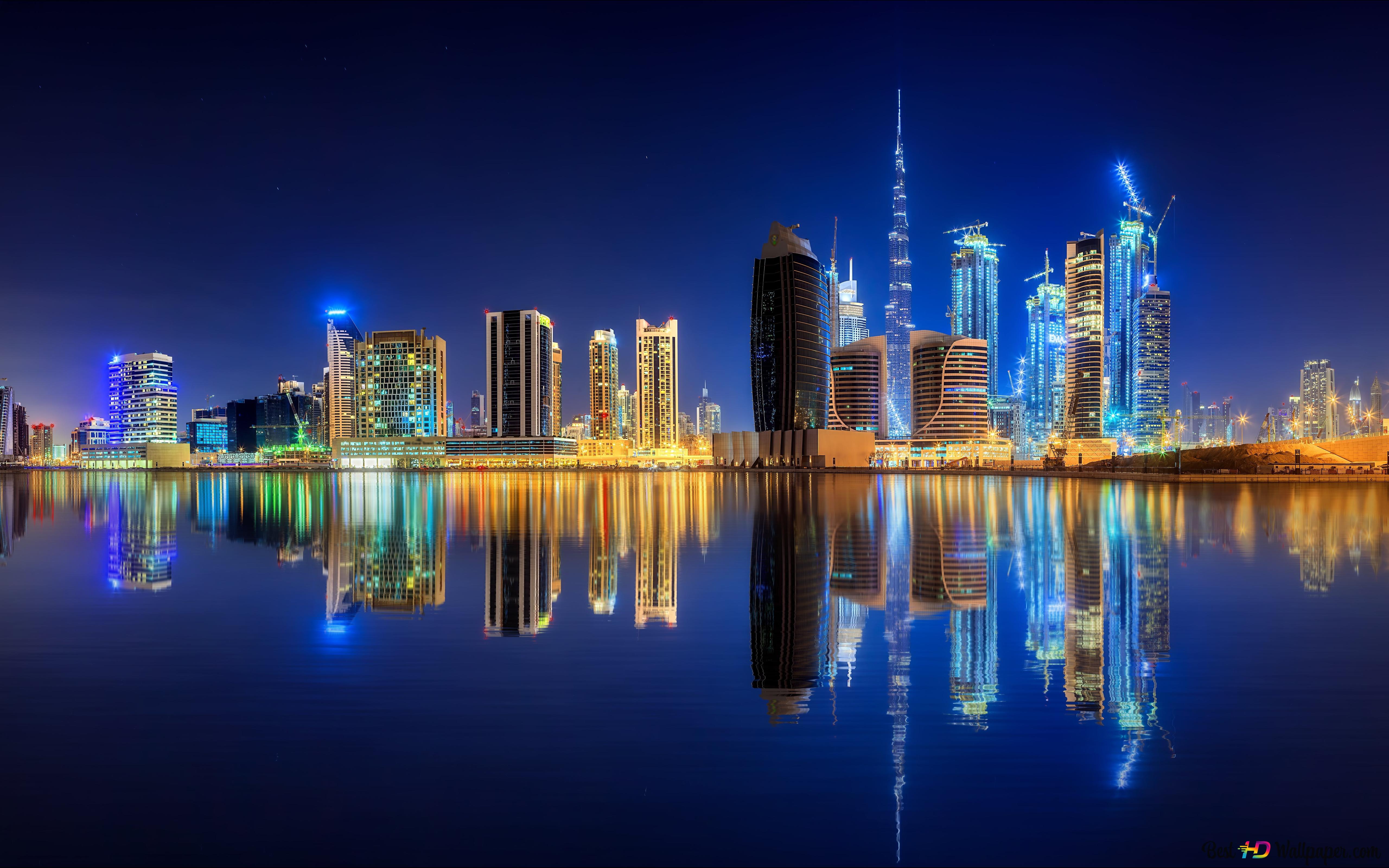 Amazing Night view of Dubai having reflection in water 8K wallpaper download