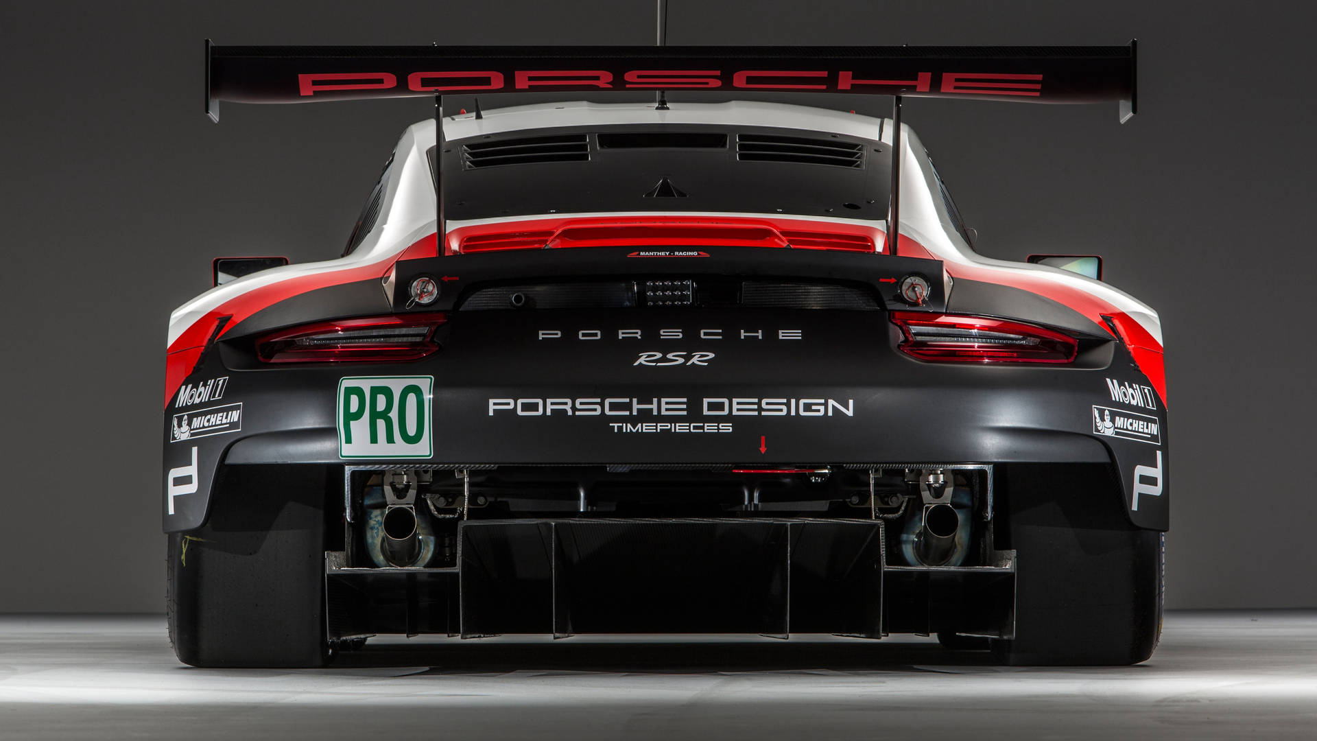 Download Porsche Racing Car Back View Wallpaper