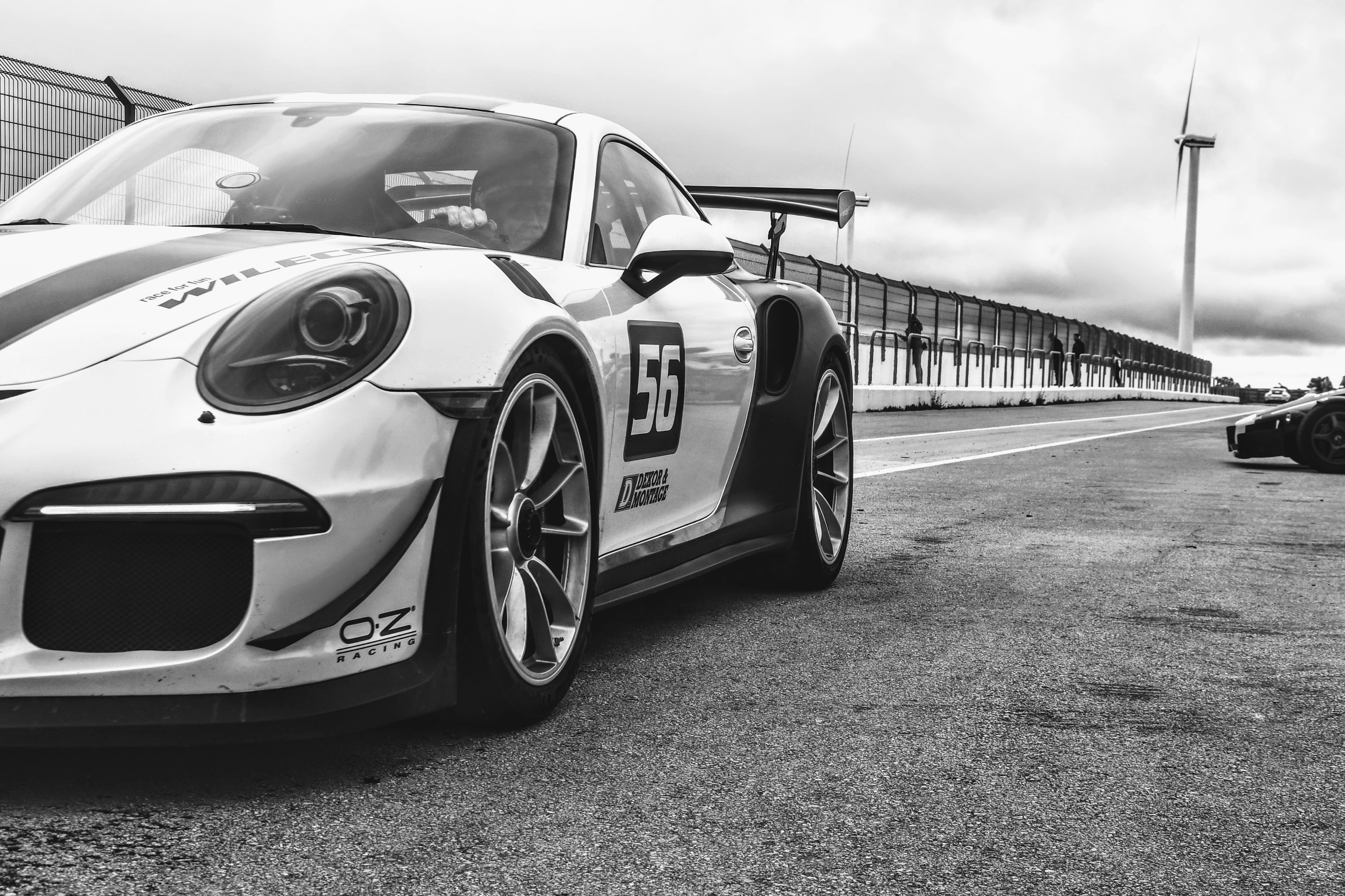 A black and white photo of a race car photo