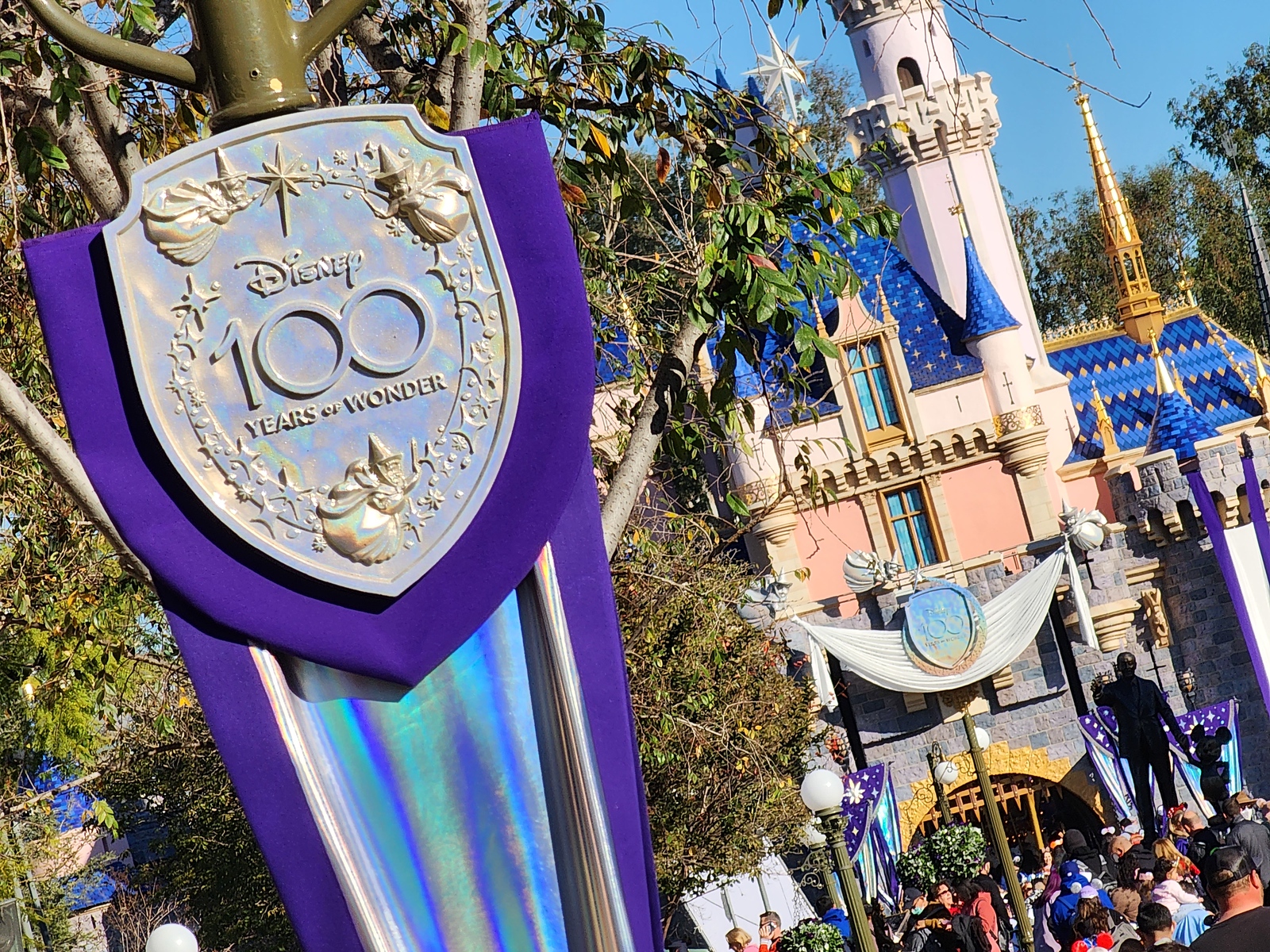 Purple and platinum inspired décor adorns the Disneyland Resort for 100 Years of Wonder celebration. #Disney100