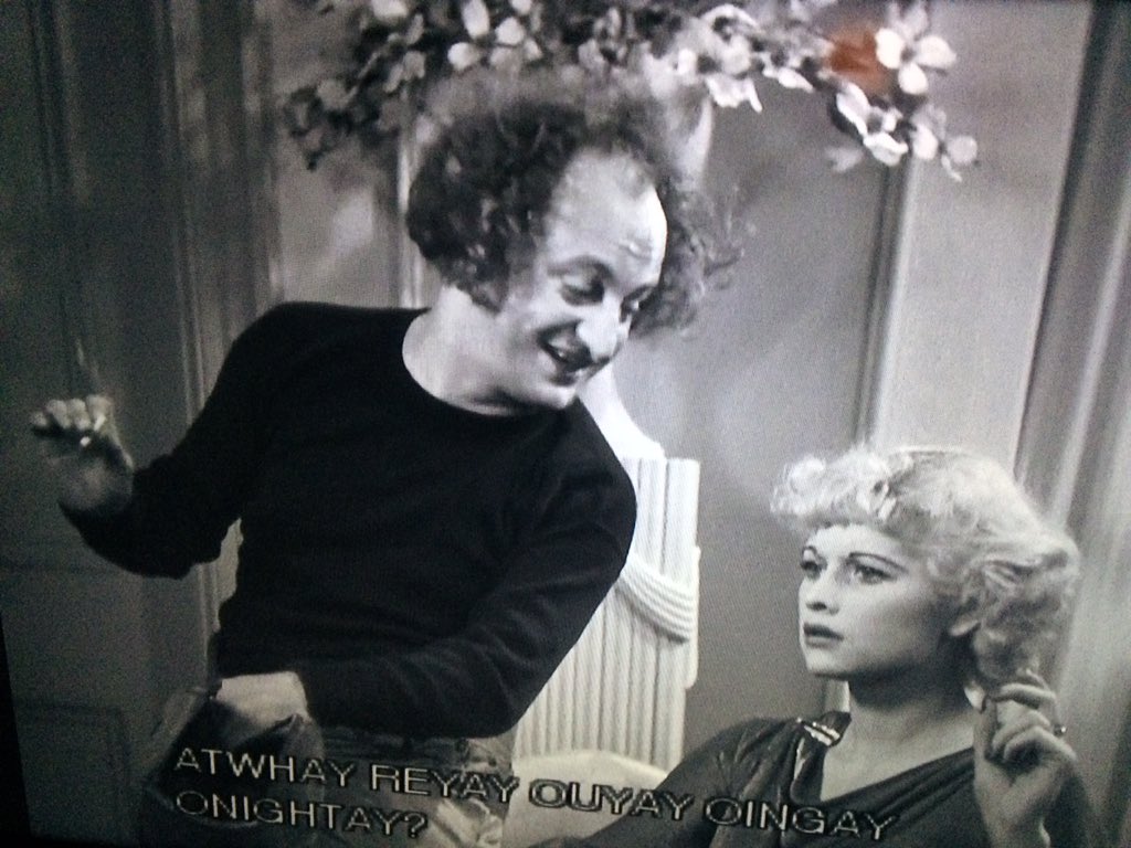 Larry Fine smoking a cigarette with Lucille Ball. Never knew she was featured in a Stooges movie