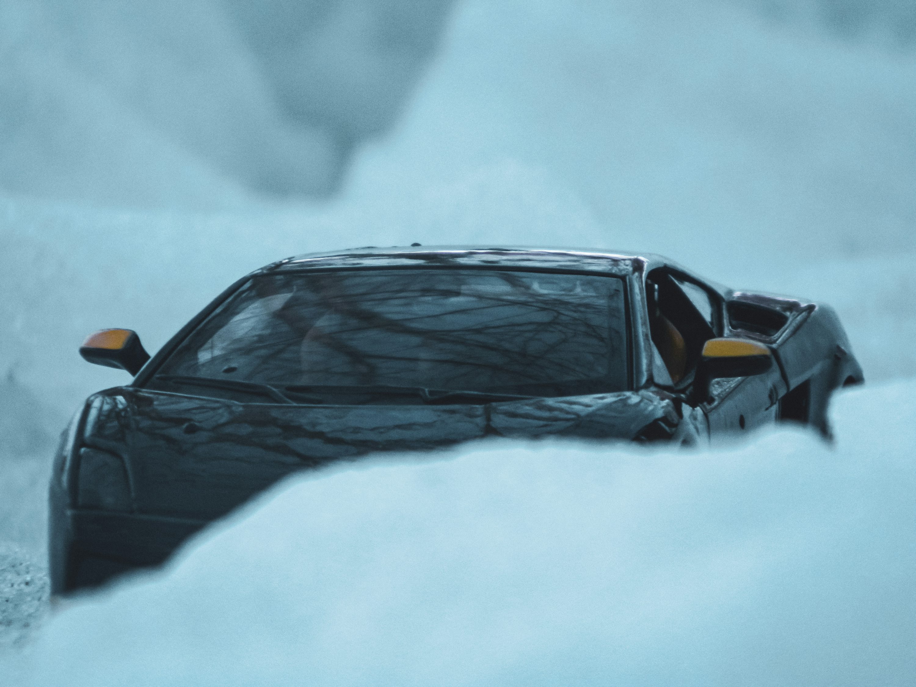 A car that is sitting in the snow photo
