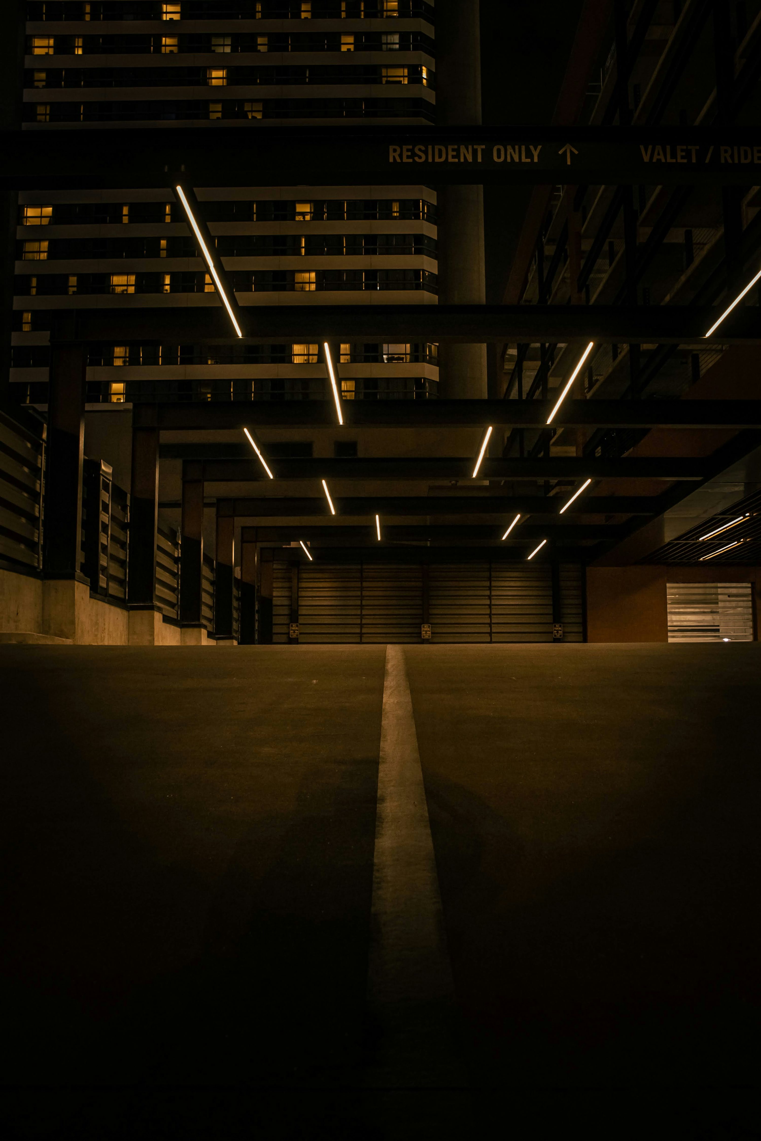 An empty parking garage in a city at night photo