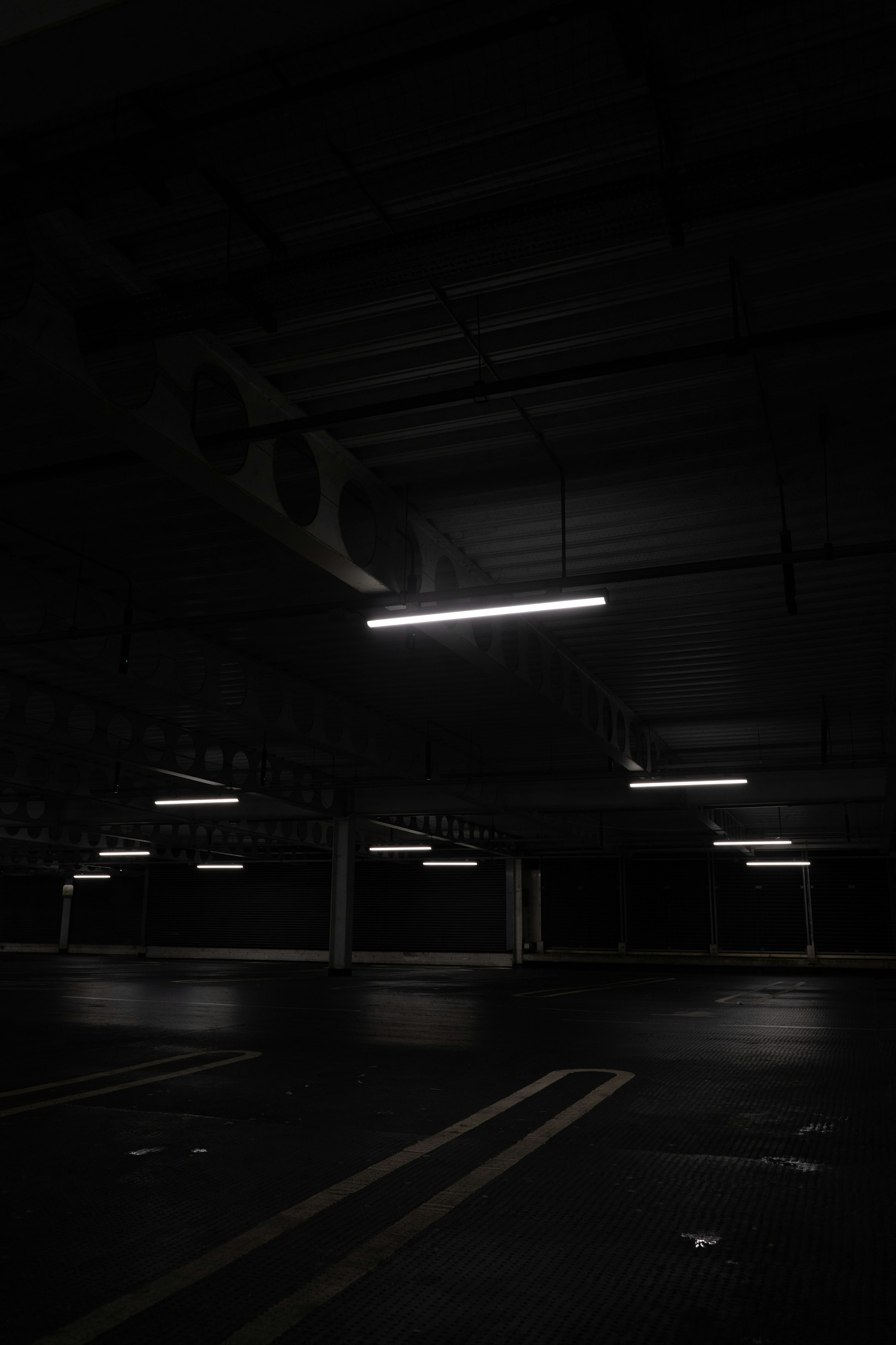 A dark empty parking garage photo