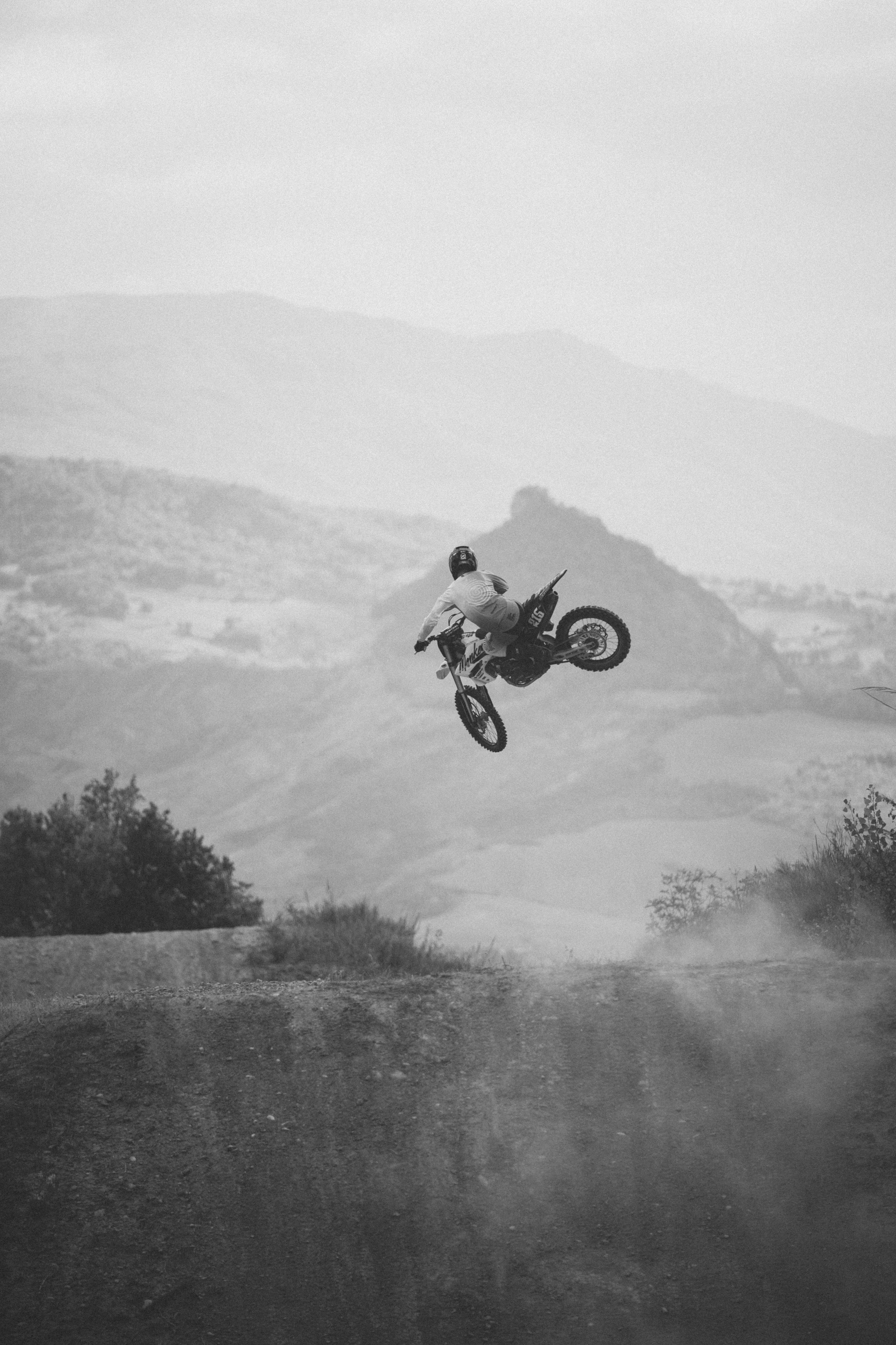 Monochrome Photo of a Person Riding a Motorcyle · Free