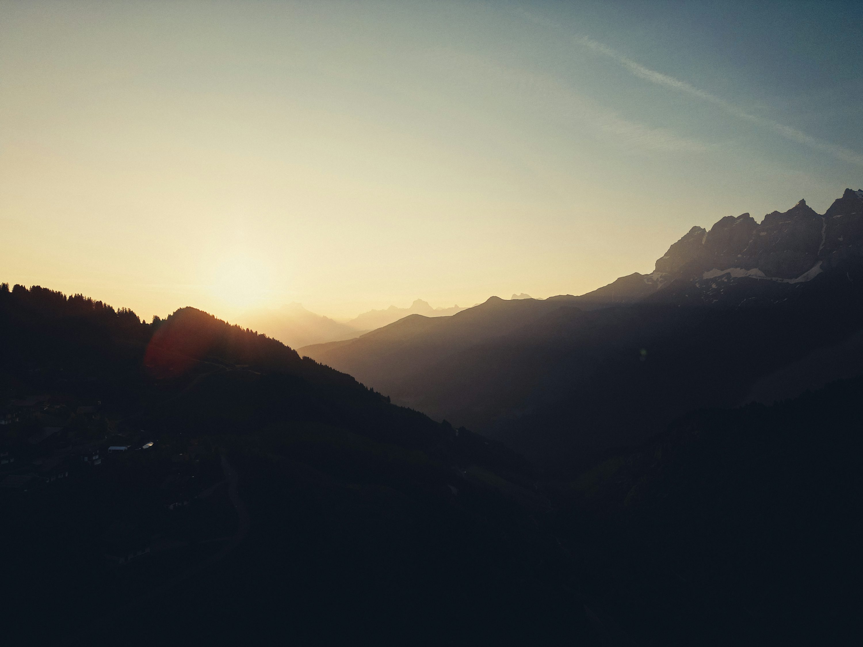 Sunset over majestic mountain peaks at dusk. photo