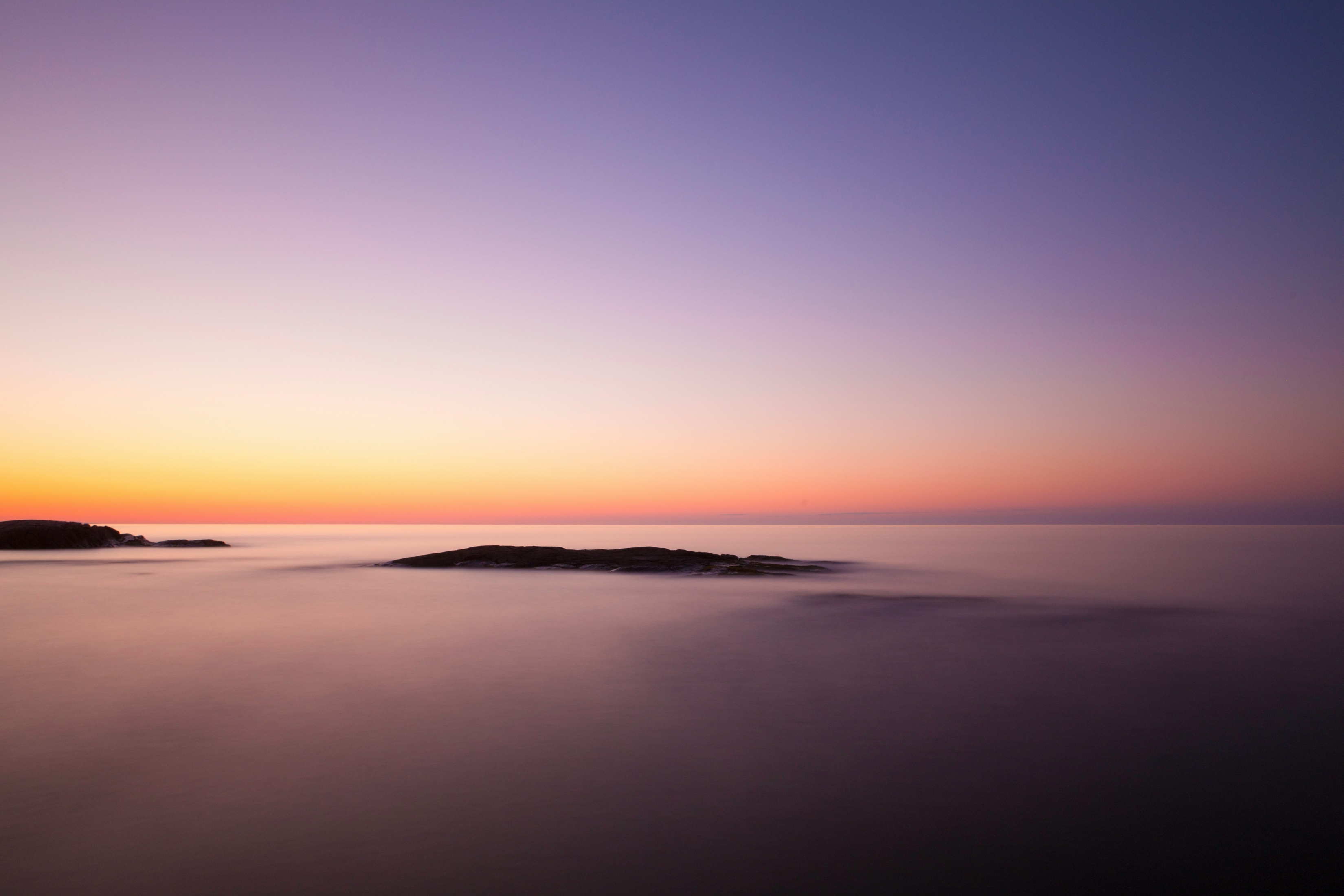Soft Sunset Over The Clouds With Mountain Peaks