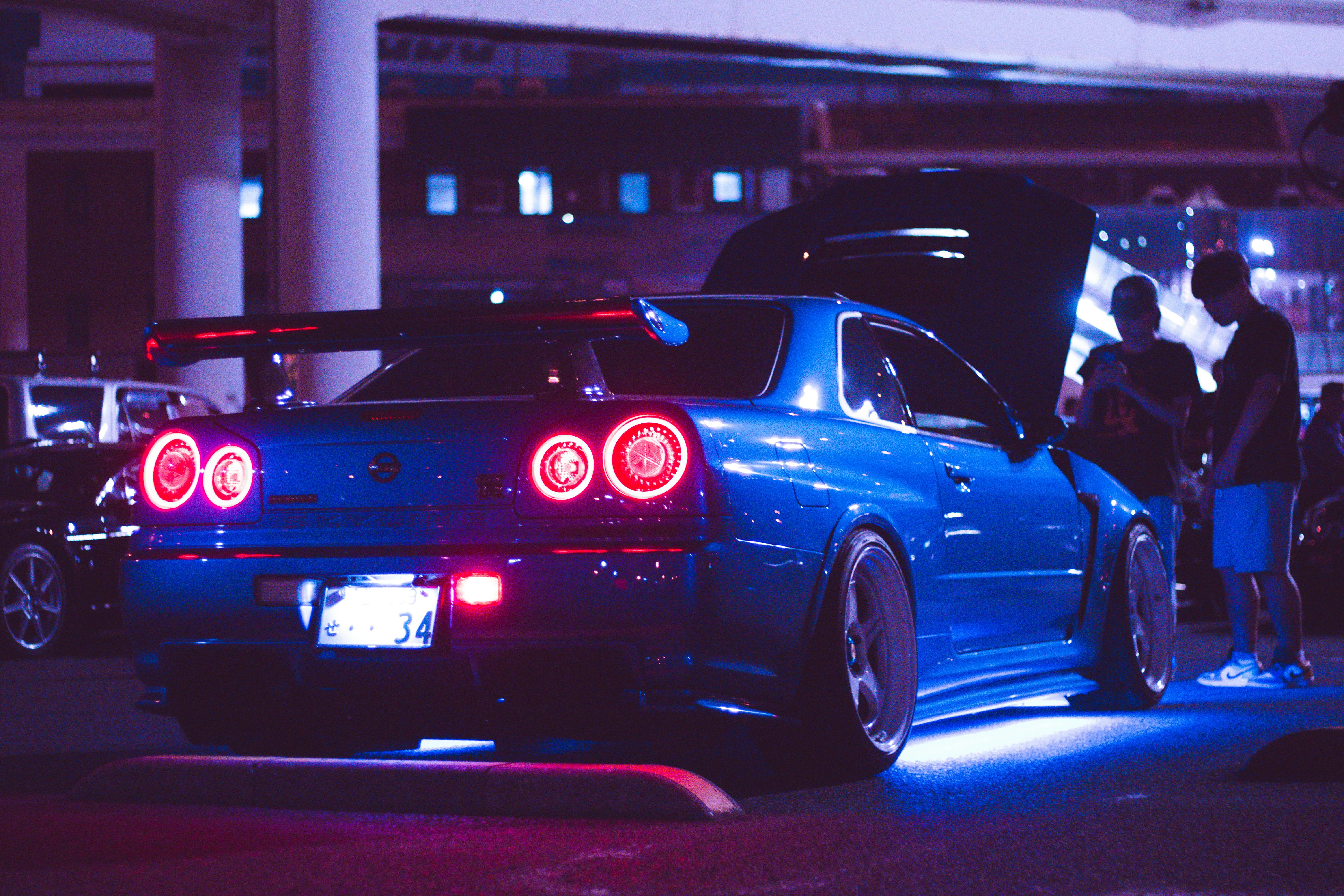 Blue Sports Car at Night with Neon Lights · Free