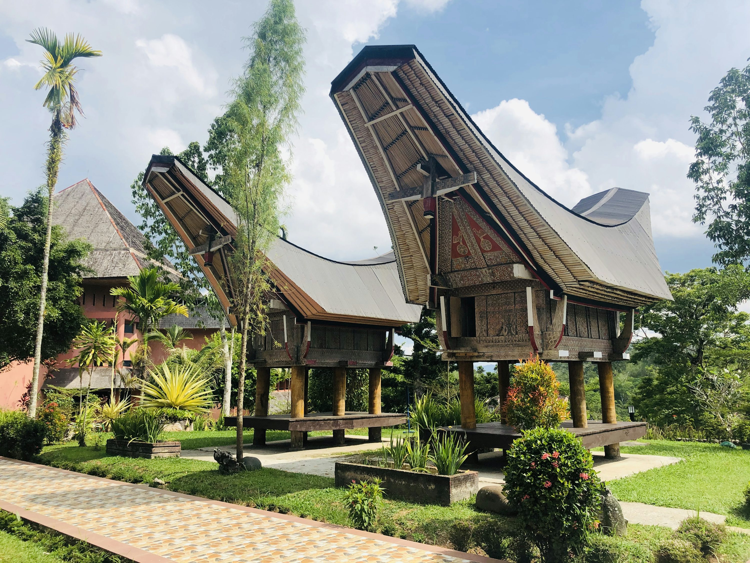 Brown wooden house surrounded by green trees under blue sky during daytime photo
