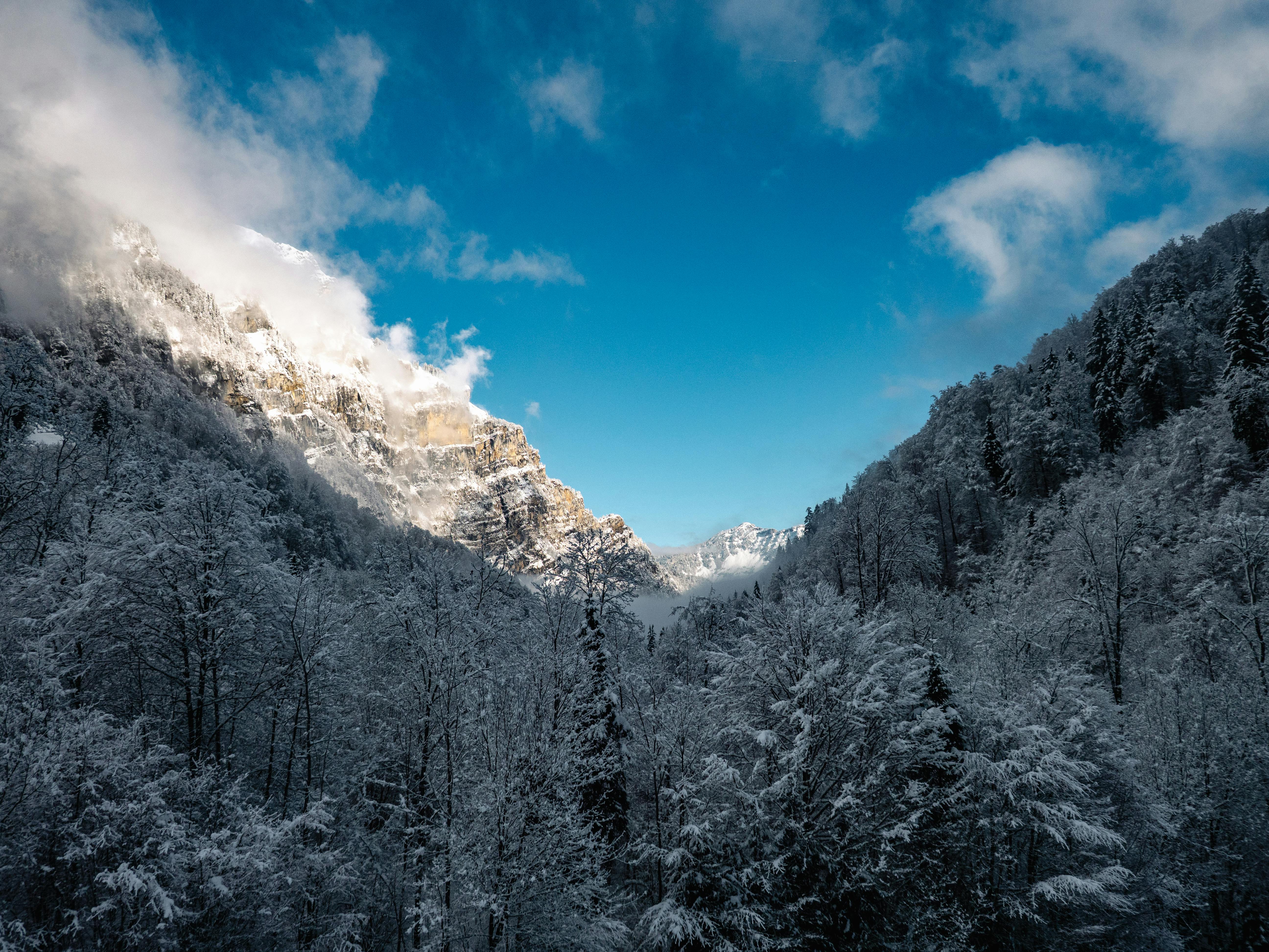 Snowy Glarus Mountains Under a Bright Winter Sky · Free