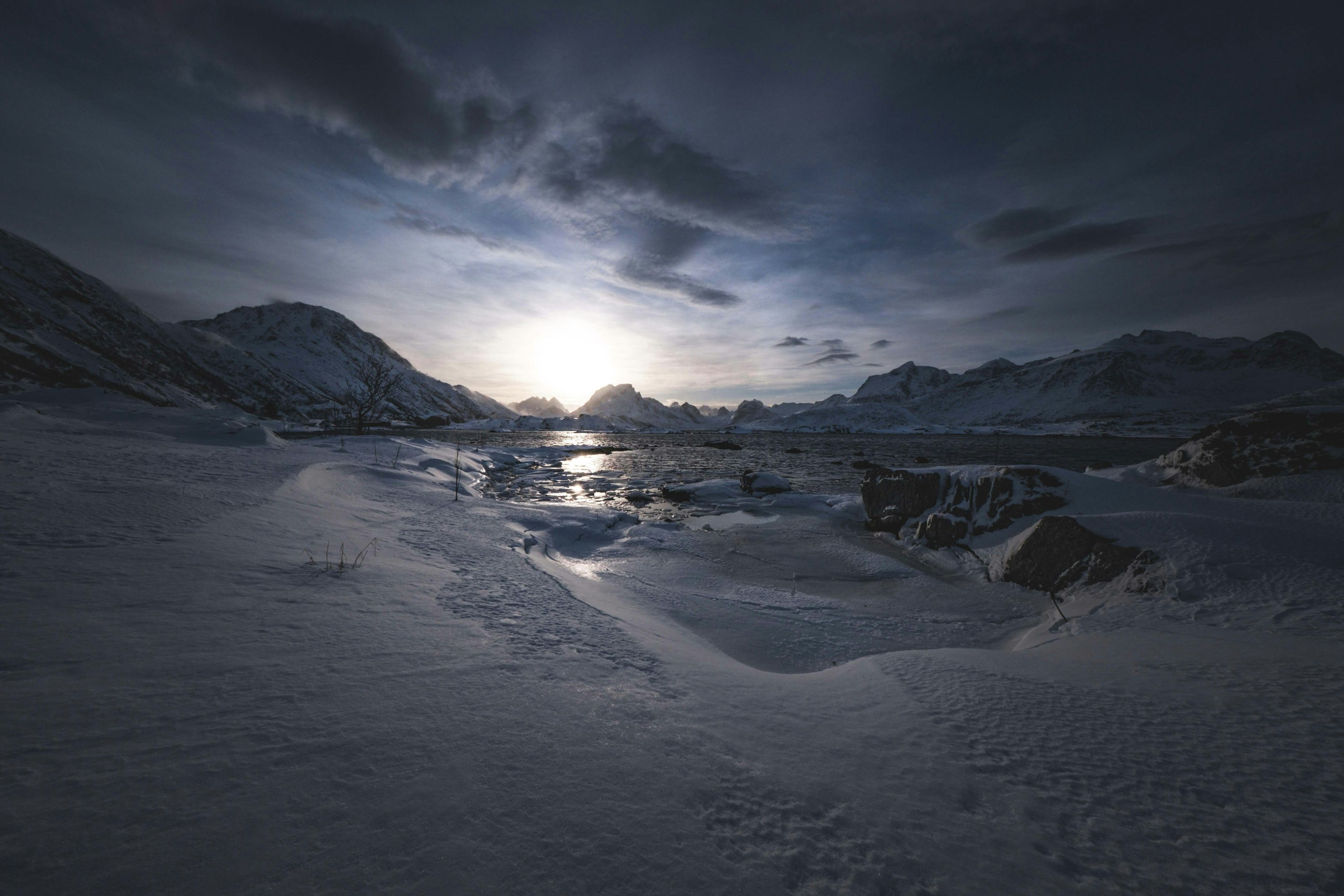 Snowy landscape with a bright, dramatic sunset. photo