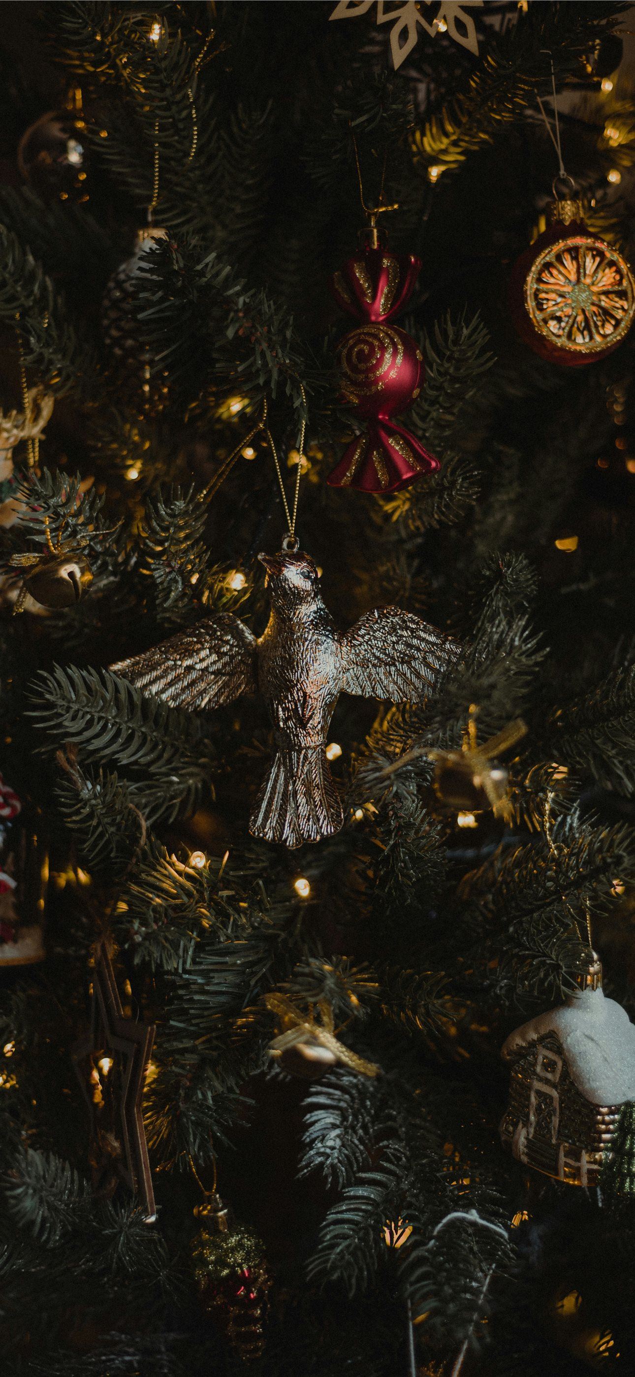 a close up of a christmas tree with ornaments iPhone Wallpaper Free Download