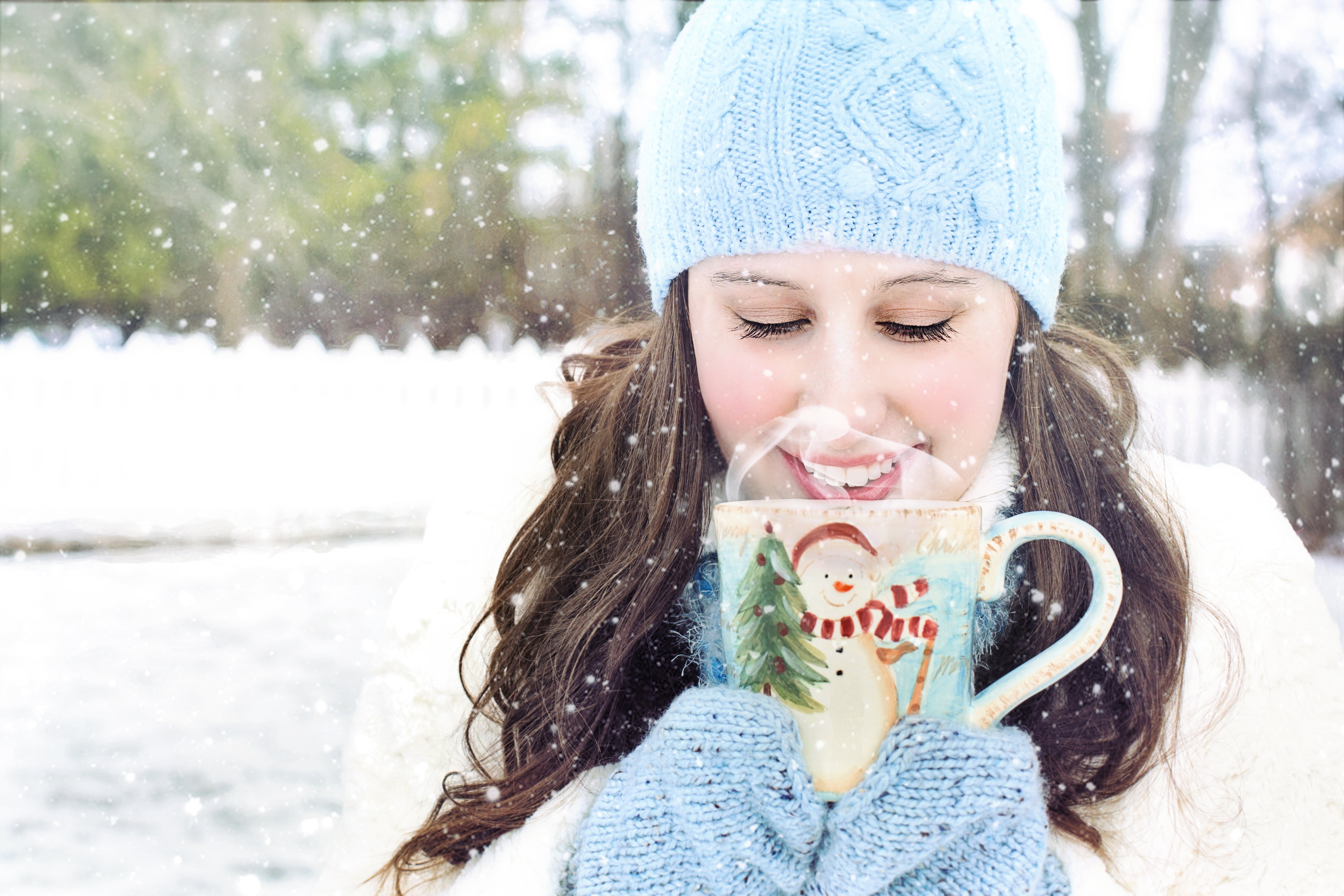 Royalty Free Photo: Woman Holding Christmas Themed Mug During Daytime