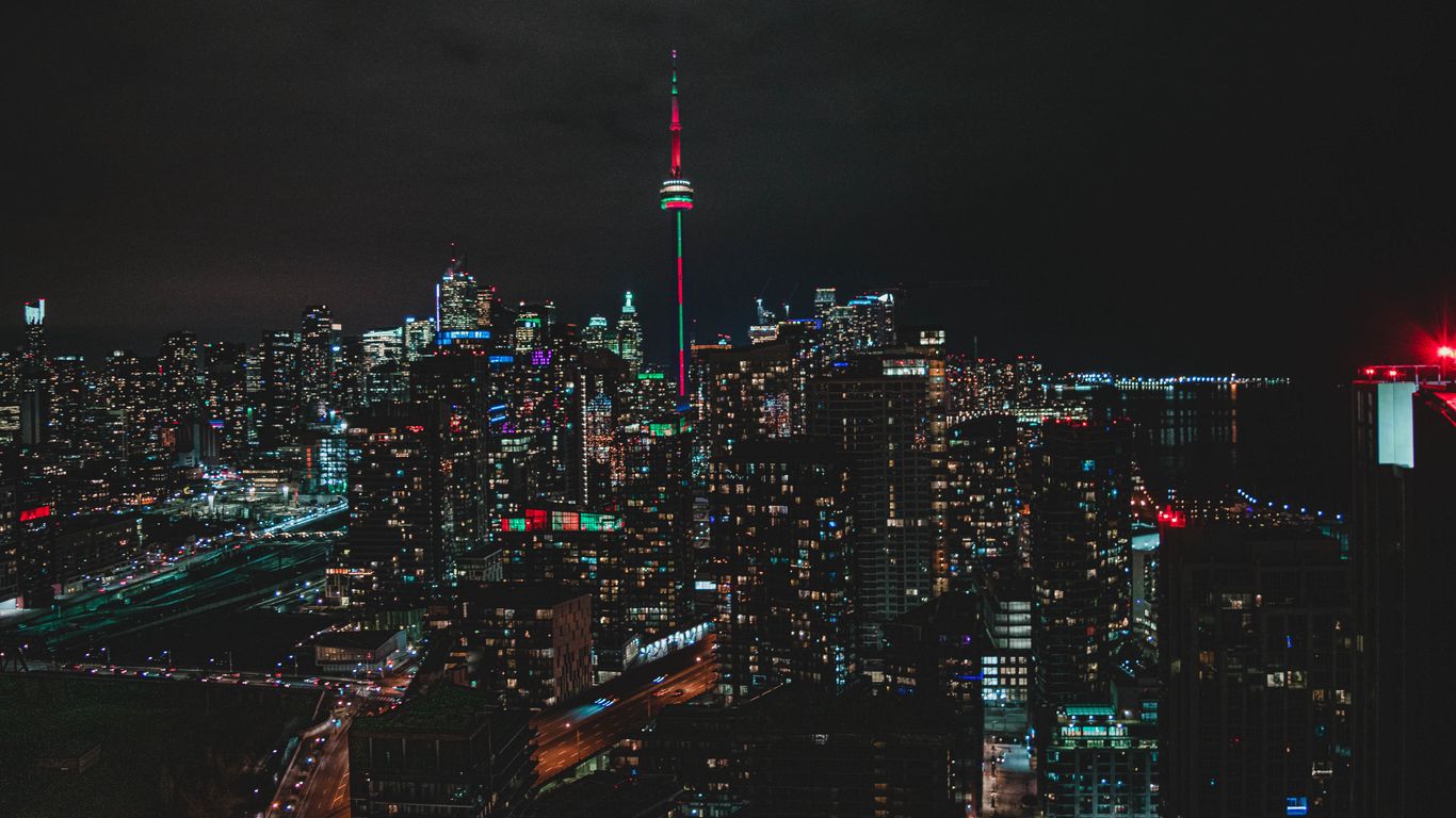 Download wallpaper 1366x768 night city, aerial view, buildings, metropolis, toronto, canada tablet, laptop HD background